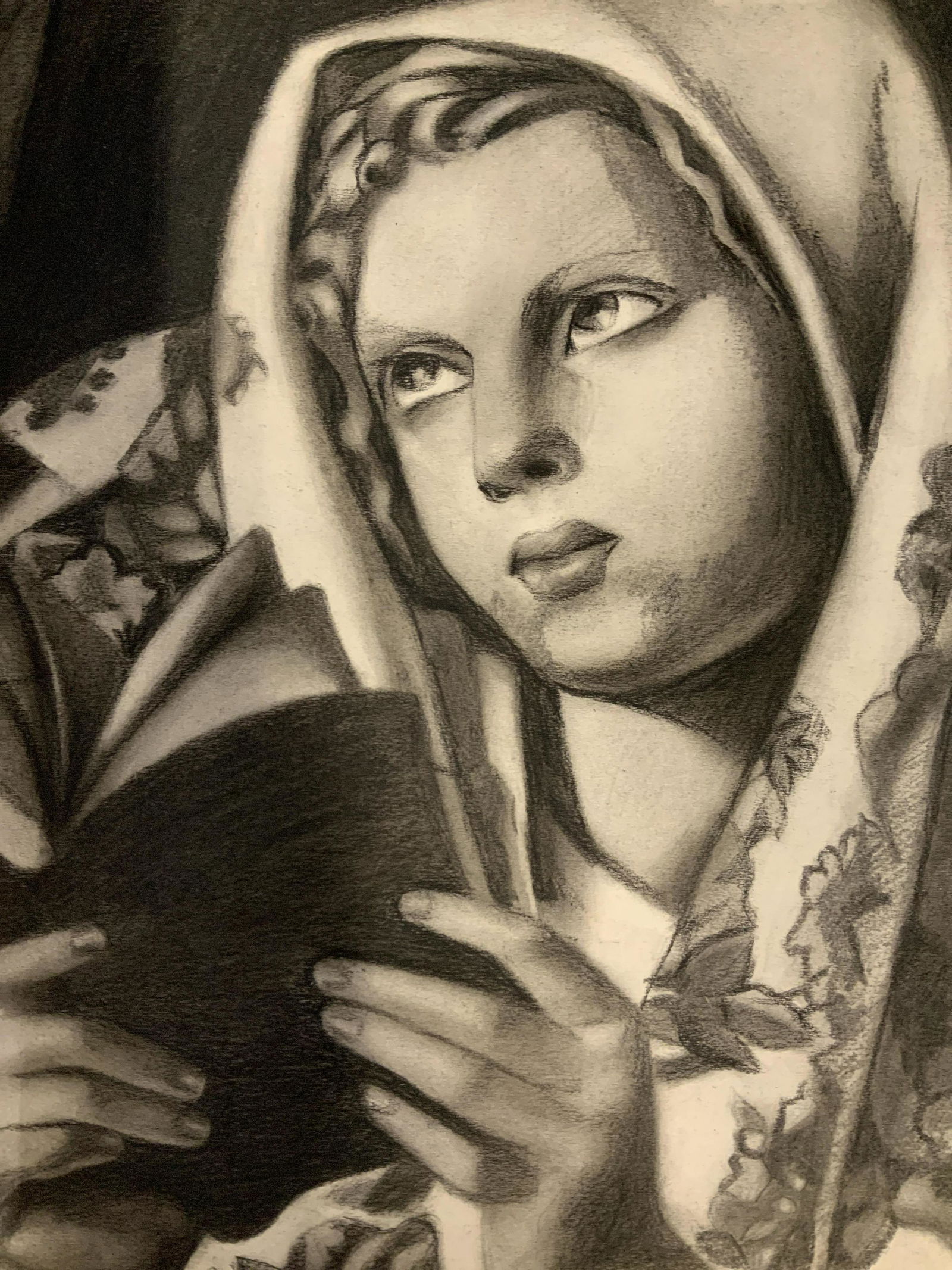 Signed Graphite Drawing AFTER Tamara De Lempicka: Signed possibly graphite drawing on paper, portrait of a woman with book and head shawl, posed in a religious manner similar to mother Mary, reverse stamp reads Darius Talyarken 10 Berkeley Square Lon
