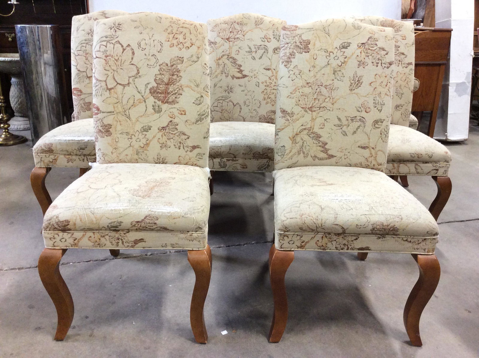 SET 8 CRATE & BARREL Upholstered Dining Chairs: Lot includes 8 dining chairs. 6 side chairs & 2 End Chairs. Each have carved wooden legs. Chairs are Upholstered with sand toned fabric & floral & leaf detail . Underside have tags which reads CRATE &