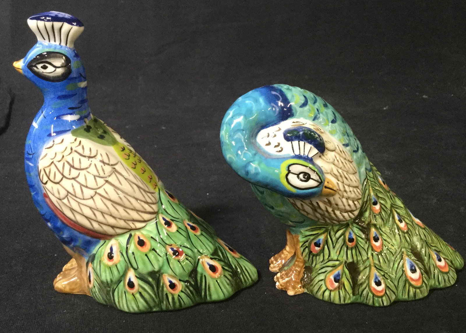 TRACY PORTER Peacock Salt & Pepper Shaker: This is a pair of salt and pepper shakers resembling a pair of peacocks. The peacocks are hand painted, one of the peacocks bears a label on the underside reading: TRACY PORTER, THE ARTESIAN ROAD COLL