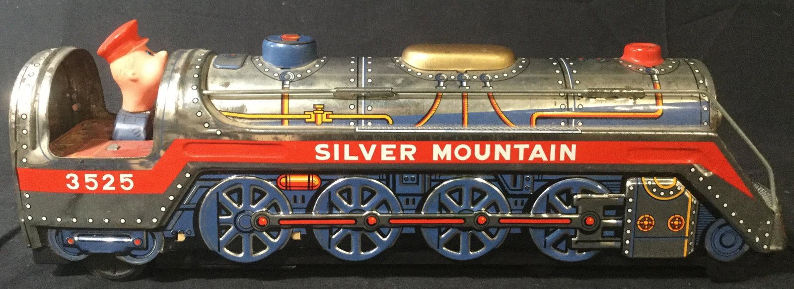 Vintage Battery Operated SILVER MOINTAIN Train: This is a vintage toy train, the piece is battery operated, and the toy is crafted from metal and plastic. The conductor rocks side to side as the train moves forward. The piece is made in Japan, the 