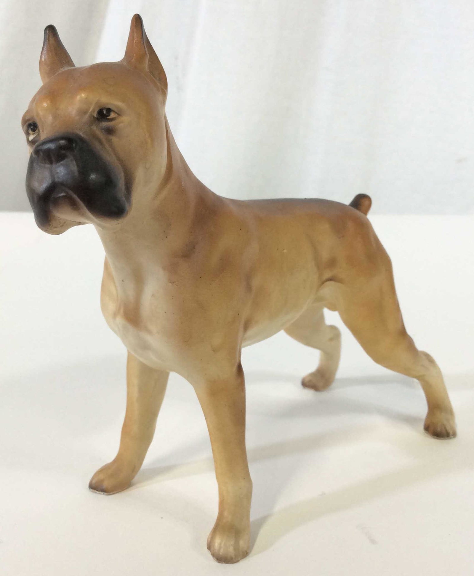 Lipper & Mann Collectible Ceramic Bulldog Figural: Lipper & Mann Collectible Ceramic Bulldog Figural. Official Lipper & Mann Creations Japan sticker on stomach. Front right paw reads 6/646. Light brown with a dark brown muzzle and back. Measures appro