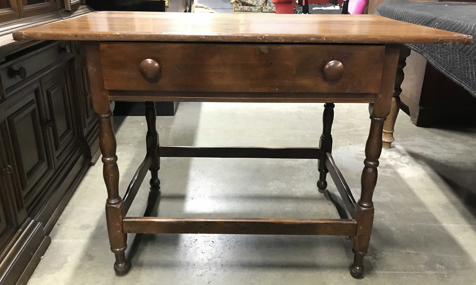 Vintage Carved Wooden Work Desk W Drawer: Desk is wooden. Piece is vintage possibly antique. Desk has 1 Drawer with 2 knob style handles. Drawer appears to have hand dovetailing. Piece measures approximately 31 inches tall 44 inches long 27 i