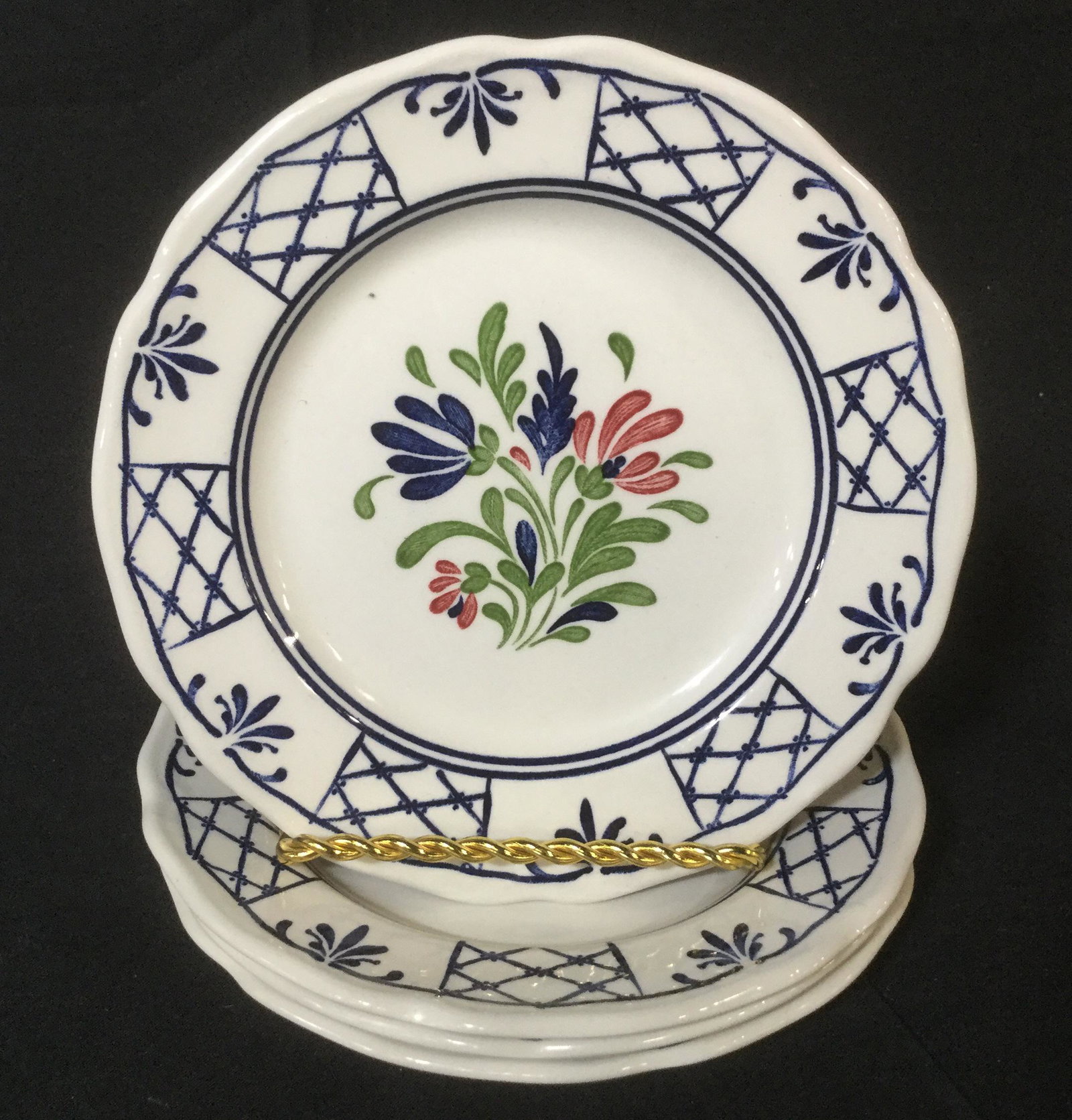 Set 9 JOHNSON BROTHERS Ironstone Dinner Plates: This lot includes 9 Ironstone Dinner Plates. The plates feature art depicting floral arrangements as well as lattice like designs around the lip of the plates. The underside of each plate reads: JOHNS