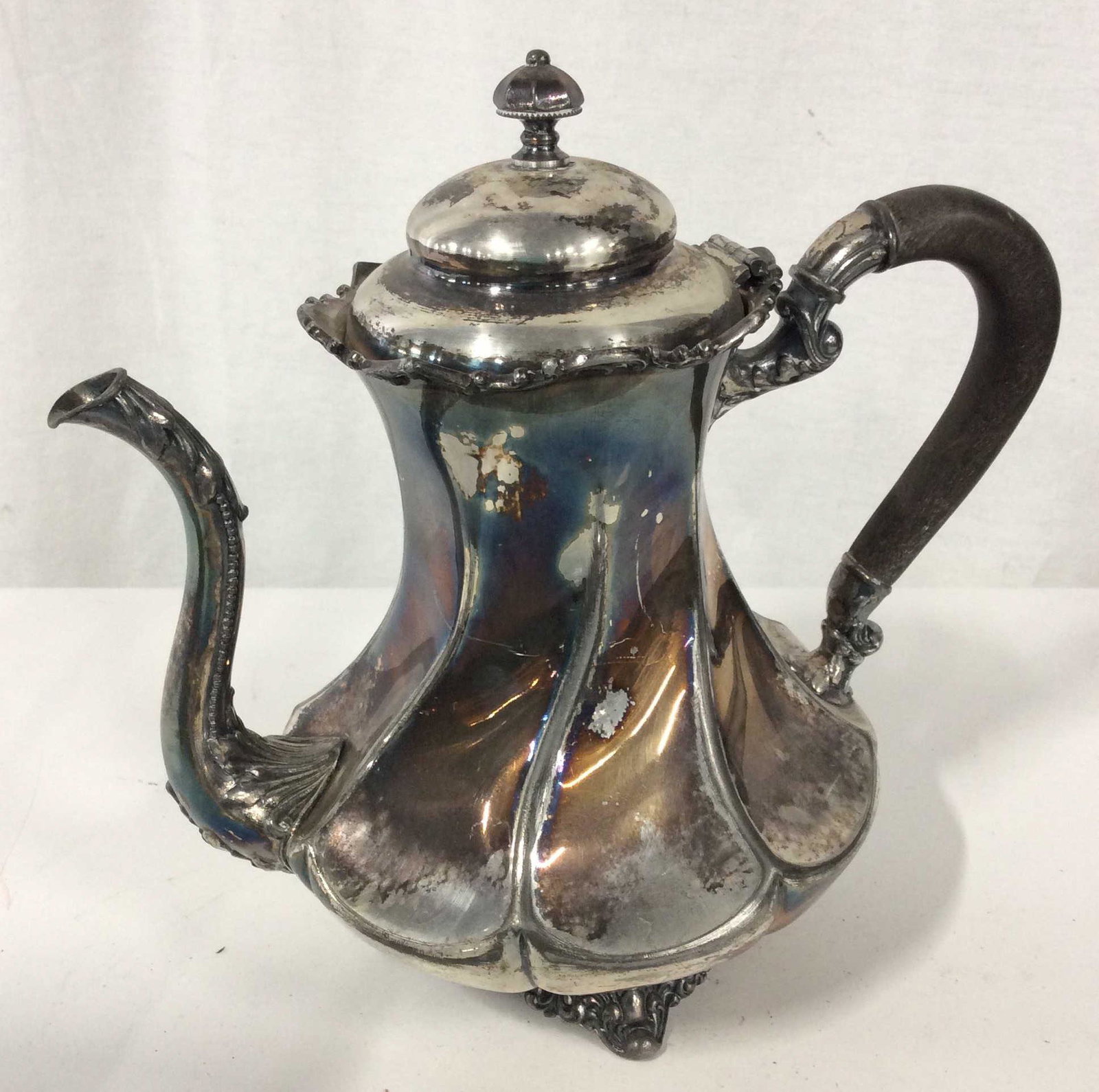 Pair Silver Toned Drinkware Service: Pair includes silver toned pitcher and coffee pot. Bottom of pitcher reads wm Rogers 317 and other markings. Bottom of coffee pot reads made and guaranteed by Meriden B company 20204 1/2 USA. Height o