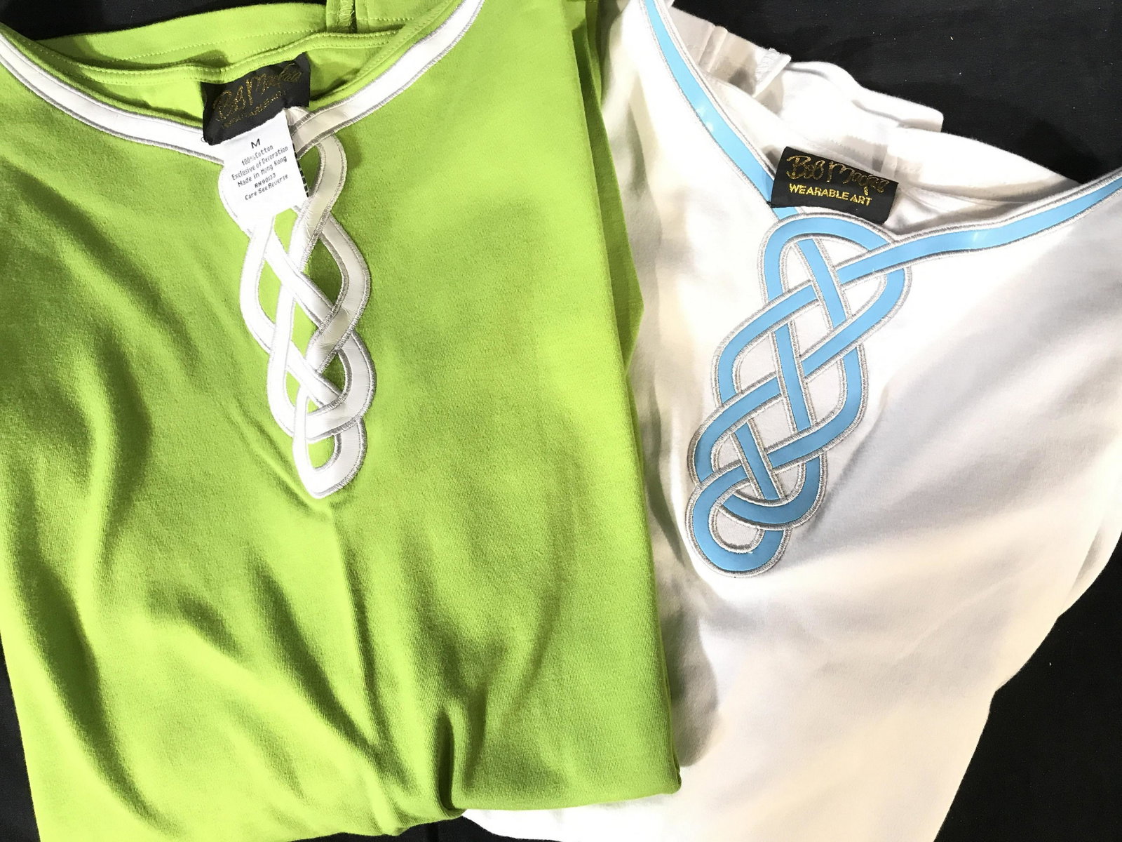 Pair Bob MACKIE Designer Cotton Shirts, Sz Med.: 3/4 sleeve tees. One white, one lime green, 100% cotton shirts from Bob Mackie’s high end ready to wear collection called Wearable Art. Long body, 28 in., covers flaws. Side slits. Property of Upper