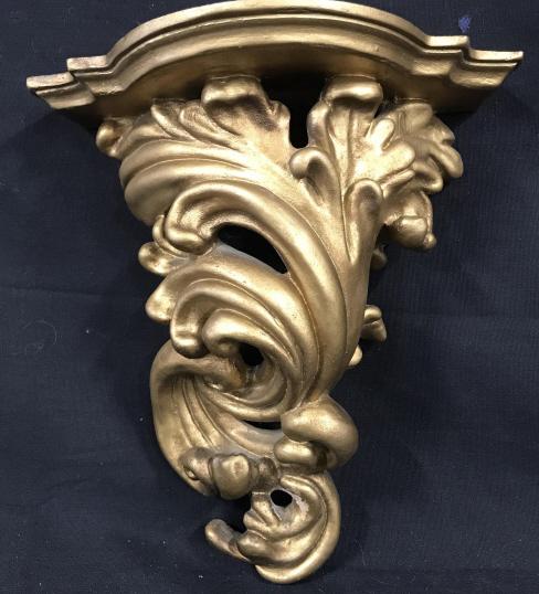 Pair Sirocco Style Demilune Bracket Wall Shelves: Ornate accent shelf, shelf top length 8.25 in, widest width4 in, narrower width 1.25 in. Total length, 10 in. Possibly plaster & wood materials. Bracket hole width app 9 mm. No hardware included. Wall