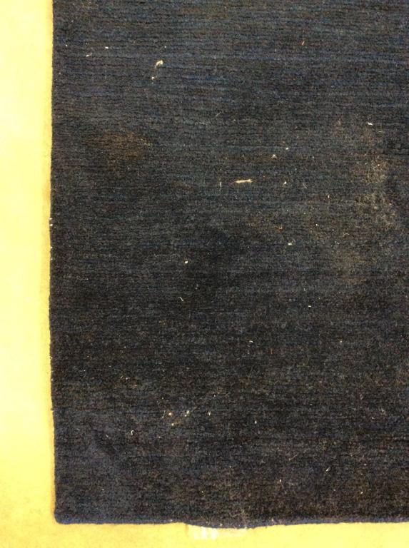 Navy Toned Handmade Wool Rug: Rug is wool and appears to be handmade. Rug is navy toned. Piece is POSSIBLY vintage. Rug, carpet, area rug, area carpet, navy rug, handmade rug, wool rug, wool carpet, blue rug. Rug measures approxim