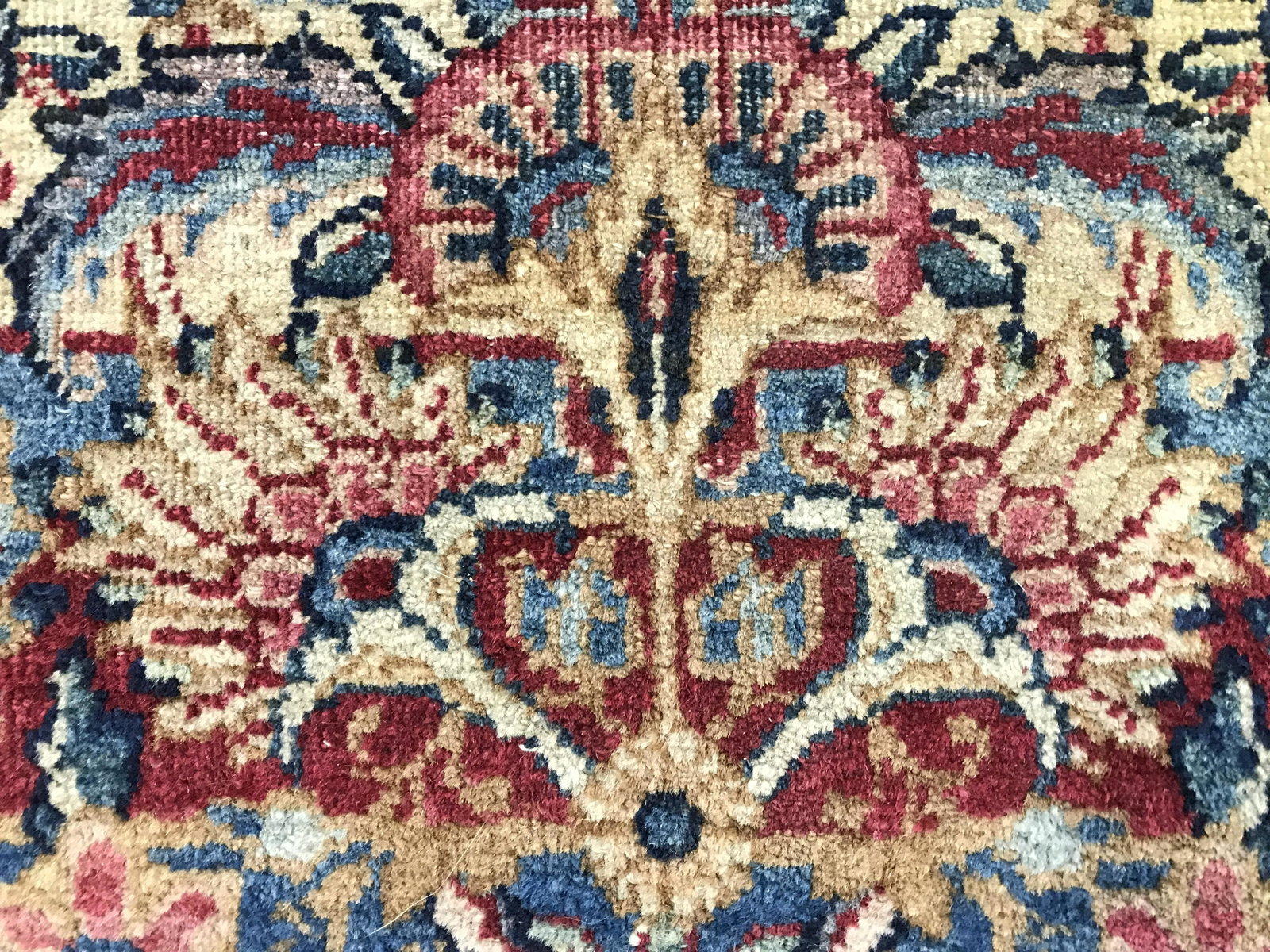 Antique Handmade Oriental Wool Rug: Rug is wool and handmade. Piece appears to be Oriental. Rug is antique. Piece contains intricate multi toned floral vine and leaf detail. Rug, carpet, area rug, wool rug, antique rug, vintage rug, han