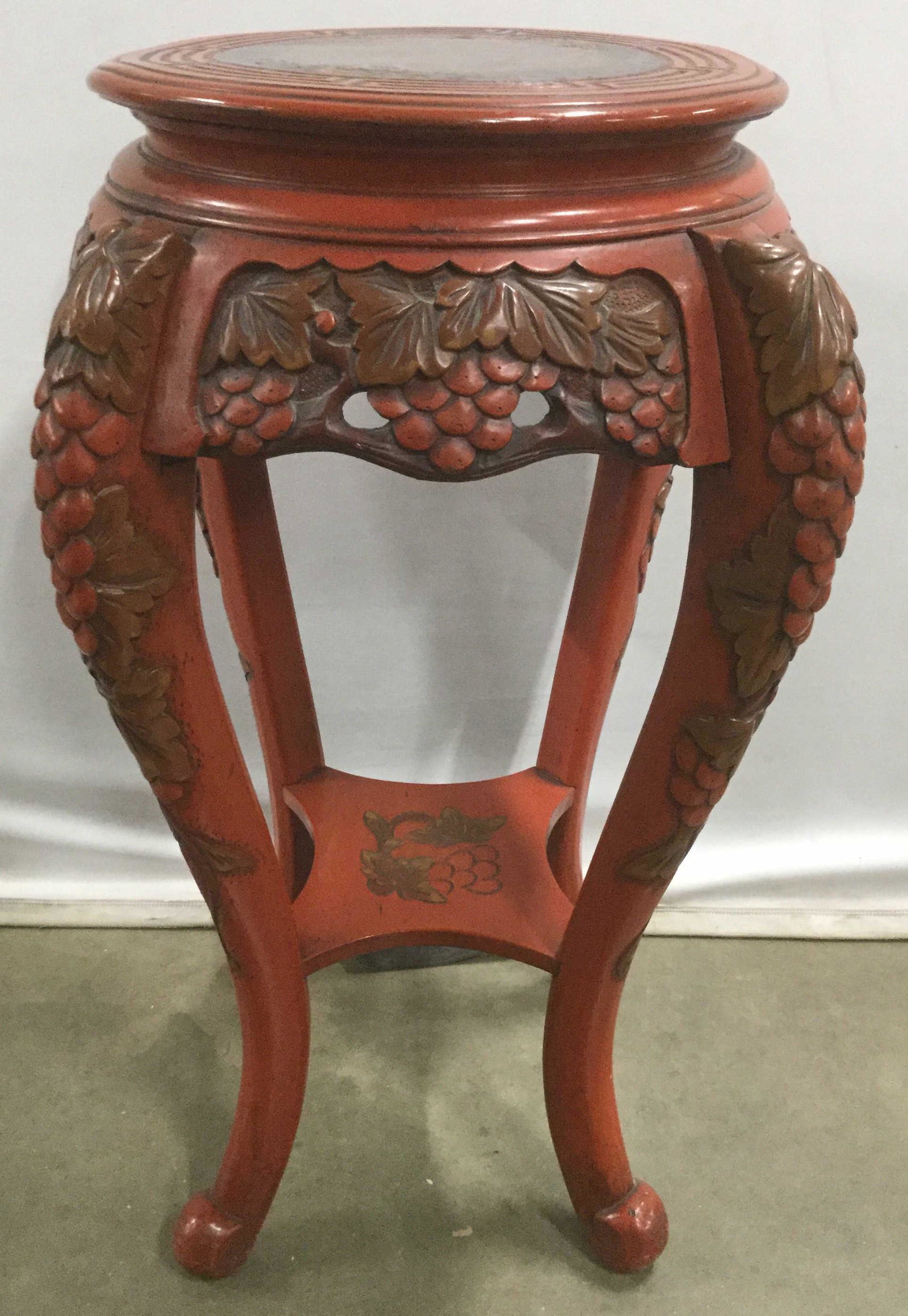 Antique Japanese Hand Carved Accent Table: This is an antique, Lacquered, Wooden accent table. The piece is hand carved, and handpainted. The legs of the table have been carved to depict a number of bushels of grapes, the tabletop has been dec