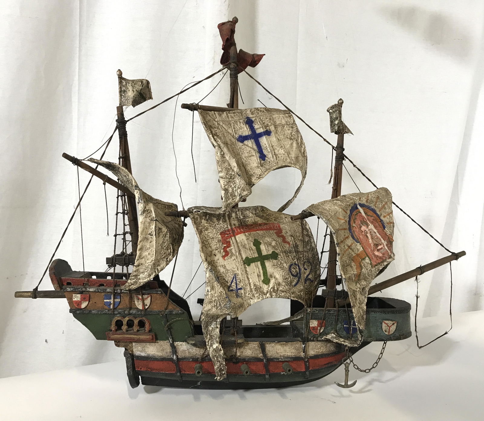 Vintage Hand Painted Santa Maria Ship Model: Vintage possibly antique Hand Painted Wooden Santa Maria Ship Model/Mobile, largest sail is marked with Santa Maria banner, cross and 1492, wooden ship is hand painted in green, red, black, and blue p