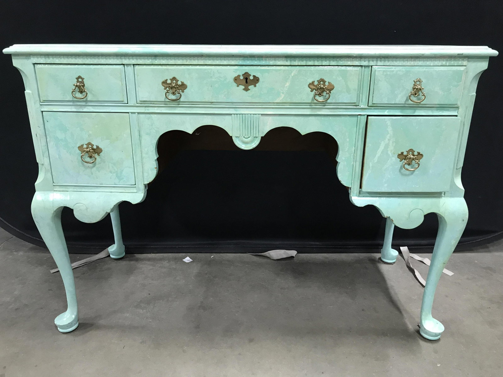 Antique Hand Painted Faux Marbelized Console Table: Table is wooden and antique. Piece is hand painted. Contains a marbleized appearance. Table contains 5 drawers each with gold toned handles which appear to possibly be brass. Table has cabriole legs &