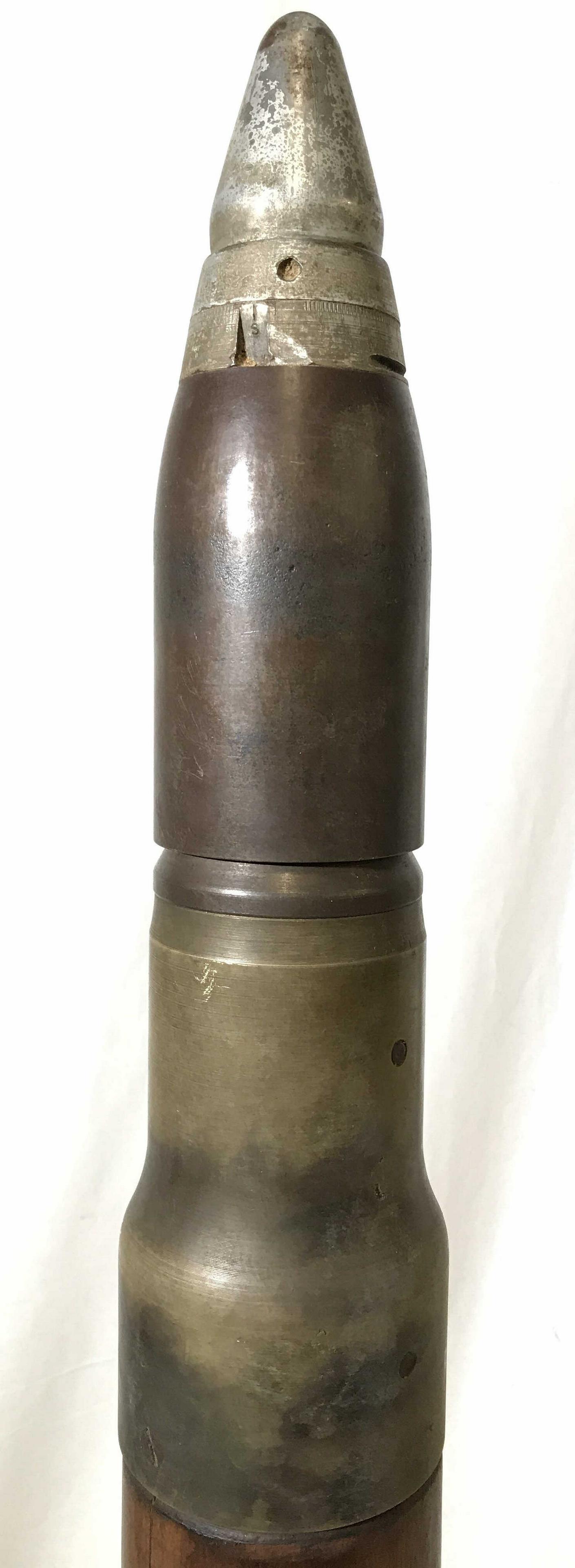 Large Vintage Military Artillery Bullet Shell: Military Bullet shell is vintage possibly antique. Piece is composed of wood and metal. Piece measures approximately 33 inches tall 4 inches wide. Vintage bullet, military shell, Tank round, vintage w