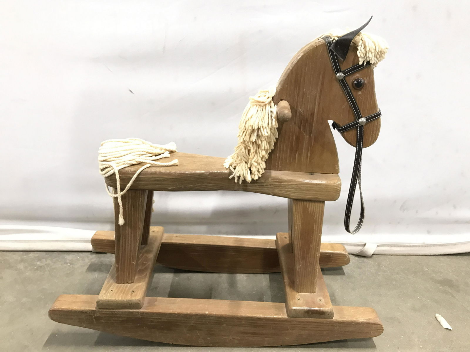 Petite Vintage Carved Wooden Rocking Horse: Rocking horse is vintage possibly antique. Piece is wooden possibly hand crafted. Piece is petite in size. Rocking horse, wooden rocking horse, vintage rocking horse, petite rocking horse. Piece measu