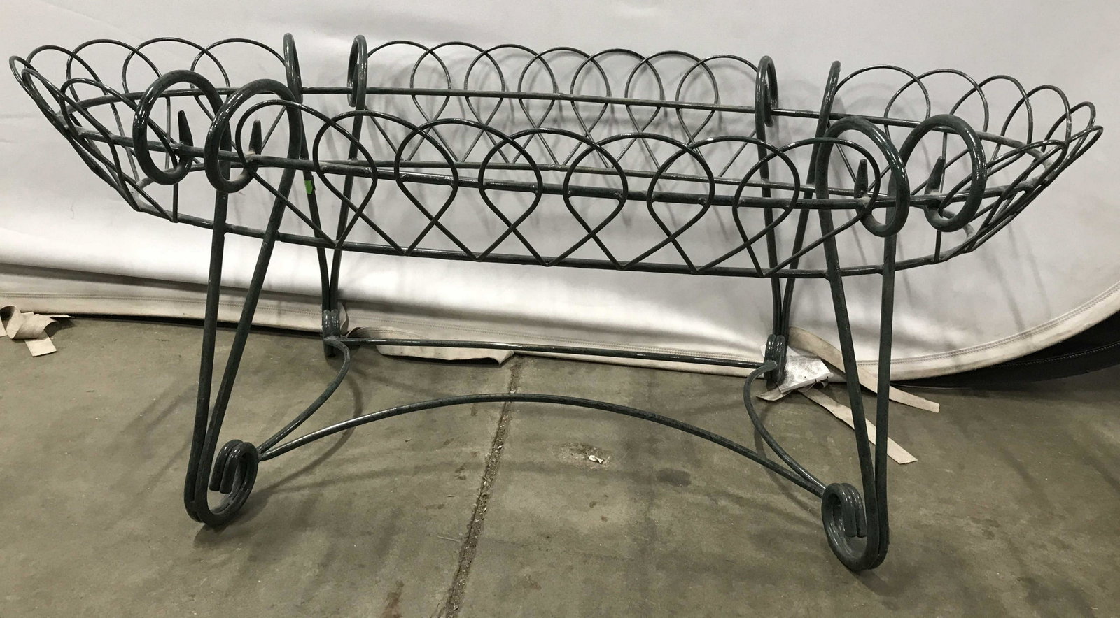 Vintage Green Toned Metal Coffee Table Base: Table base is green toned. Piece has s curve shaped legs. Piece appears to be vintage. Table base, metal table base, coffee table base, green table base. Piece measures approximately 39 long 16 inches