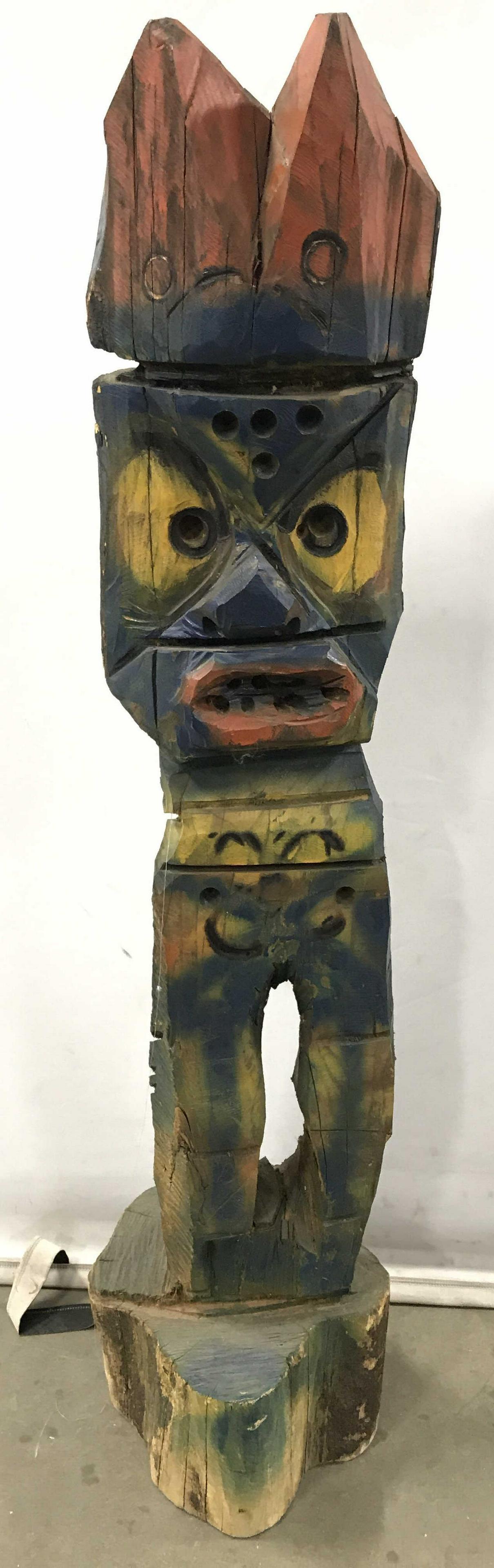 Hand Carved Hand Painted Tiki Totem: Tiki is hand painted. Piece also appears to be hand carved. Tiki is wooden. Tiki, totem, carved wooden tiki, carved wooden totem, hand carved tiki. Piece measures approximately 48 inches tall 10 inche