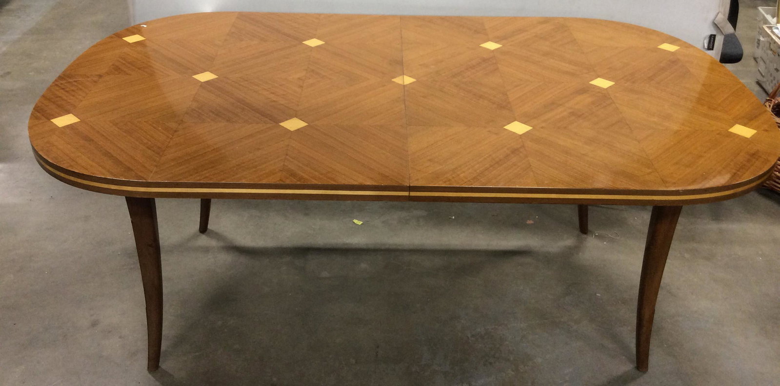 Vintage Marquetry Wooden Dining Table: Vintage Wooden Marquetry Extendable Dining Table With inlaid diamond patterned design, splayed legged base, brass toned decorative accents on outside of legs, and two extension leaves, measures approx
