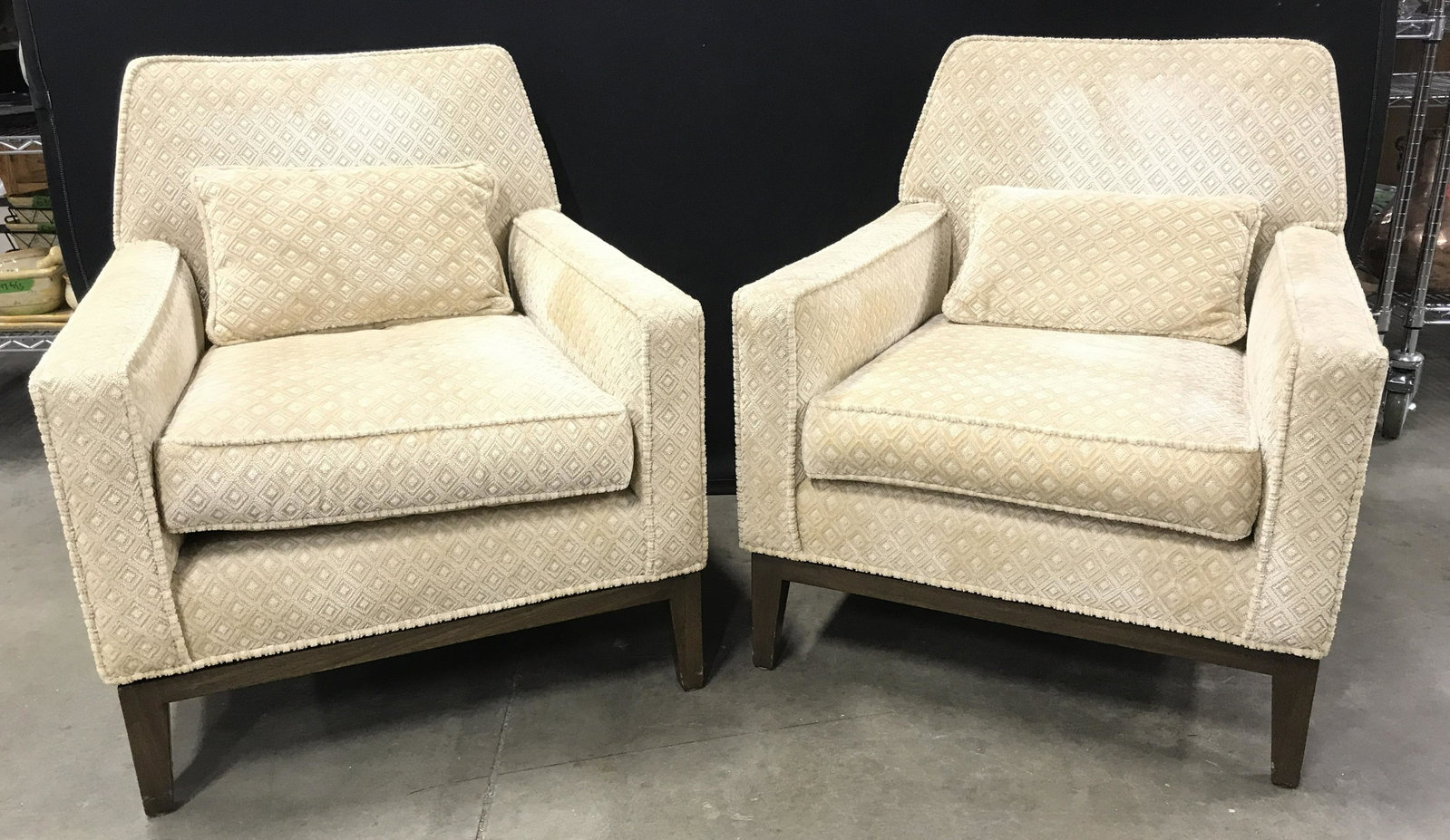 Pair MCM Paul McCobb Style Upholstered Arm Chairs: Pair Vintage Paul McCobb Style Mid Century Modern Upholstered Armchairs with walnut toned wooden base, upholstered in cream toned fabric with diamond patterned design and welted trim, some scratches t