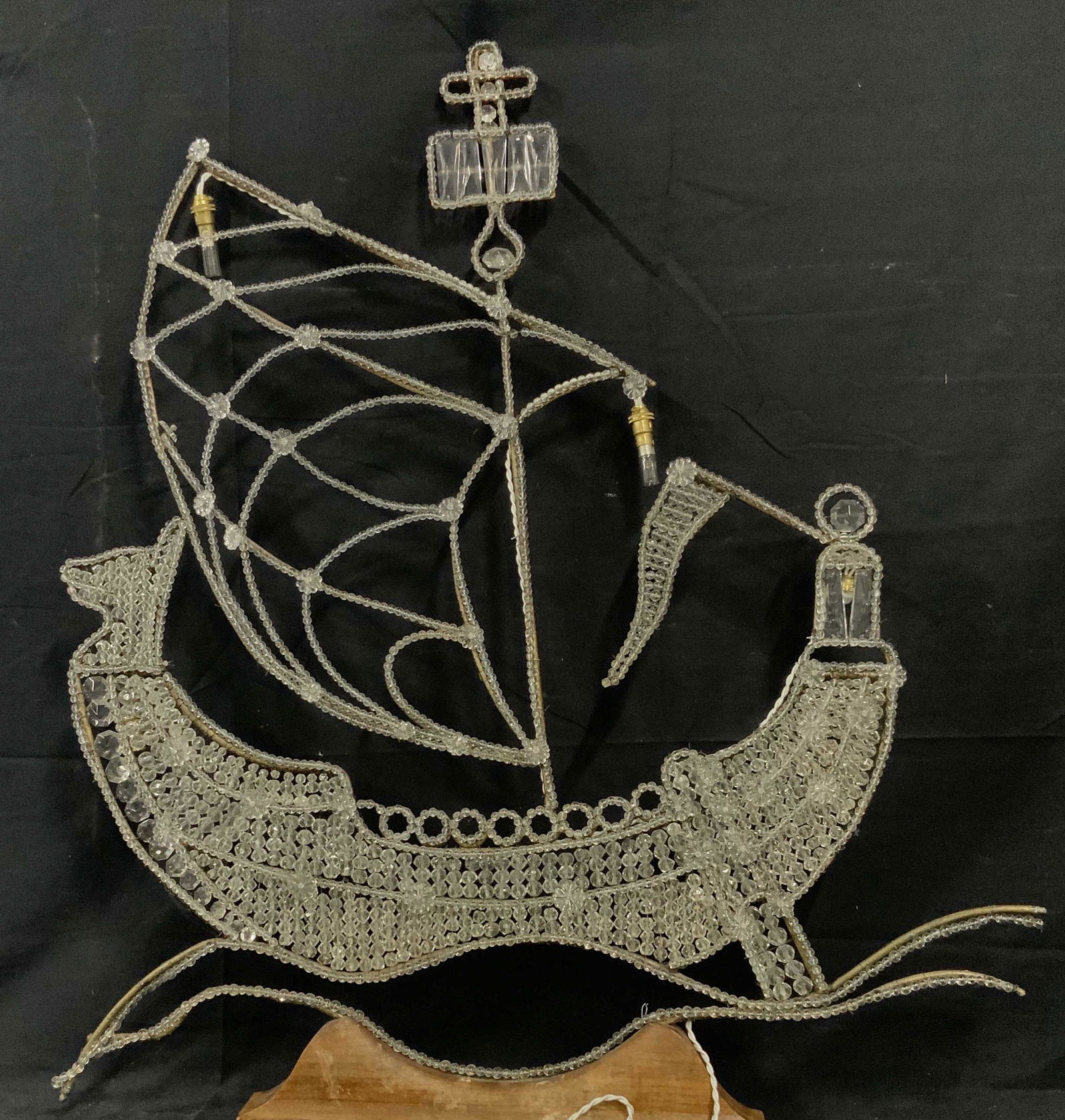 European Art Glass Beaded Light up Ship: Glass beaded ship, glass possibly crystal, lights installed with European plug, bulbs look possibly antique, wooden base, base has some chips to it, metal wiring with some rust, measures 41 inches at