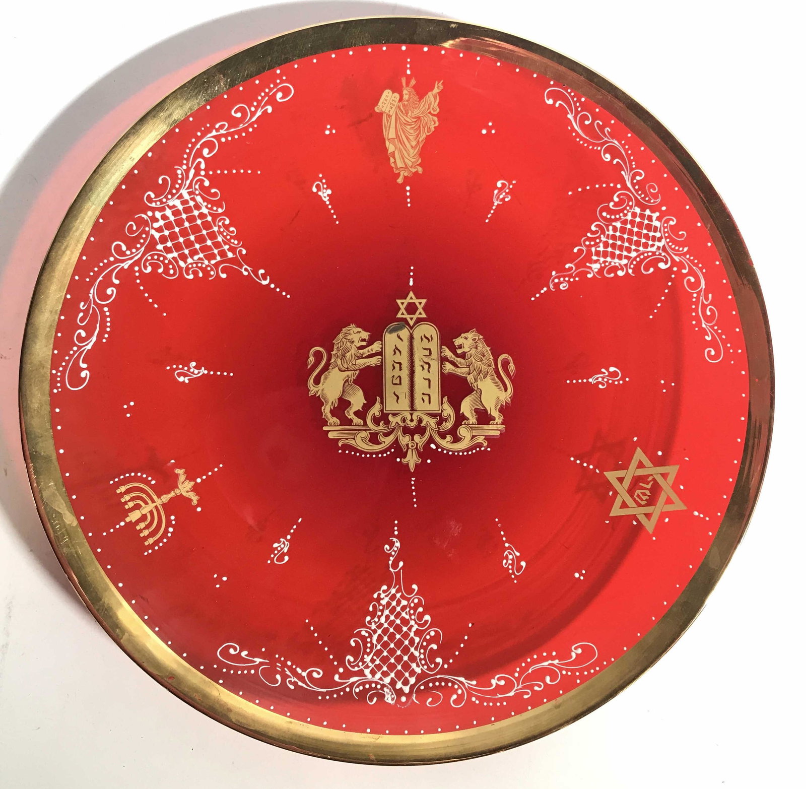 Art Glass Judaica Plate: Red toned art glass plate, handcrafted, gilt trim and details, Star of David, menorah details, white toned paste up filigree design, lions flanking 10 commandments, Figural of Moses holding commandmen