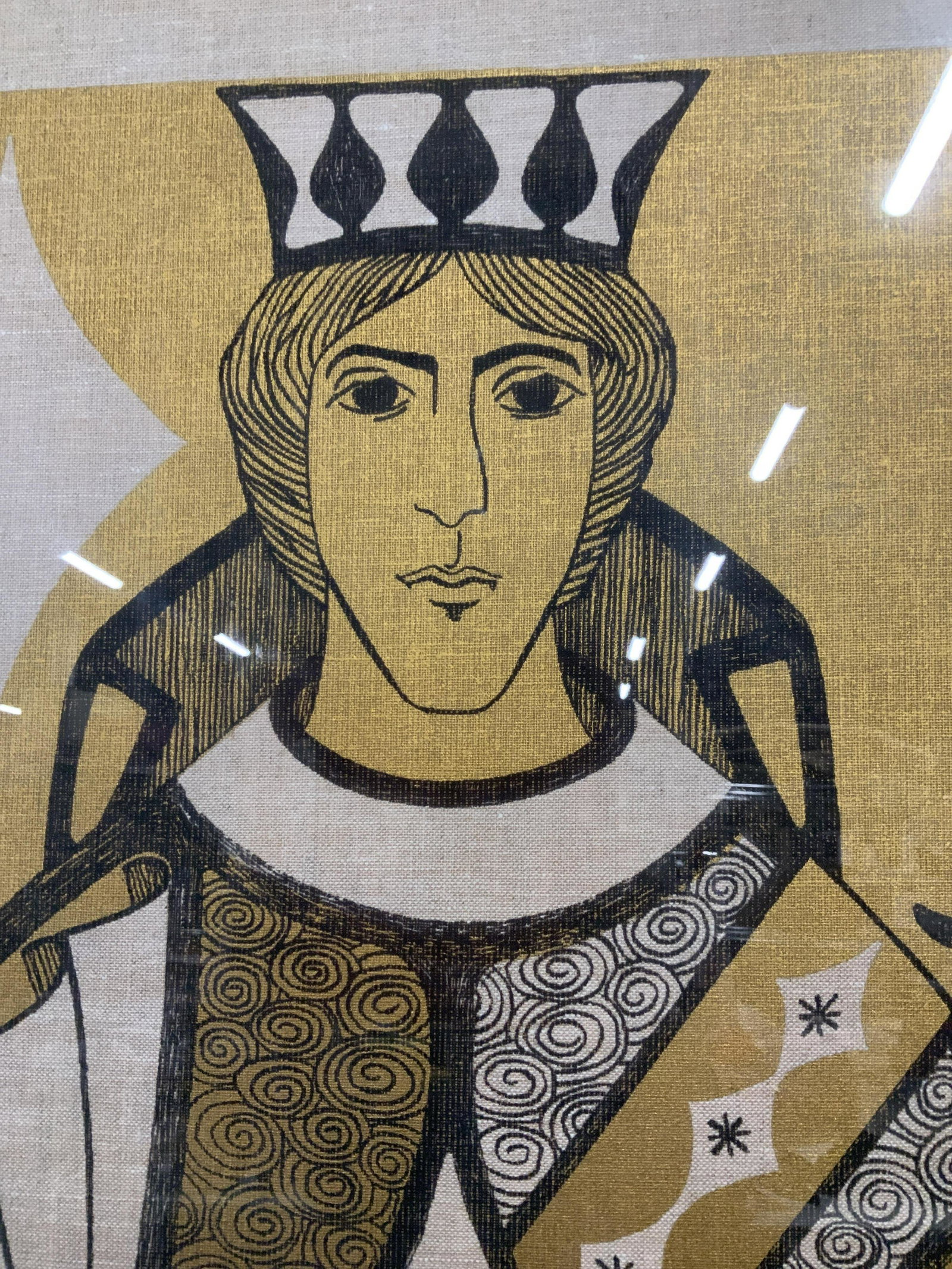 Oversized Playing Card Print on Linen: Oversized playing card print on linen, printed in only black and gold, playing card depicts the Jack of Diamonds, spirals and diamond patterns adorn the sleeves and robes of the figure, the subject ta