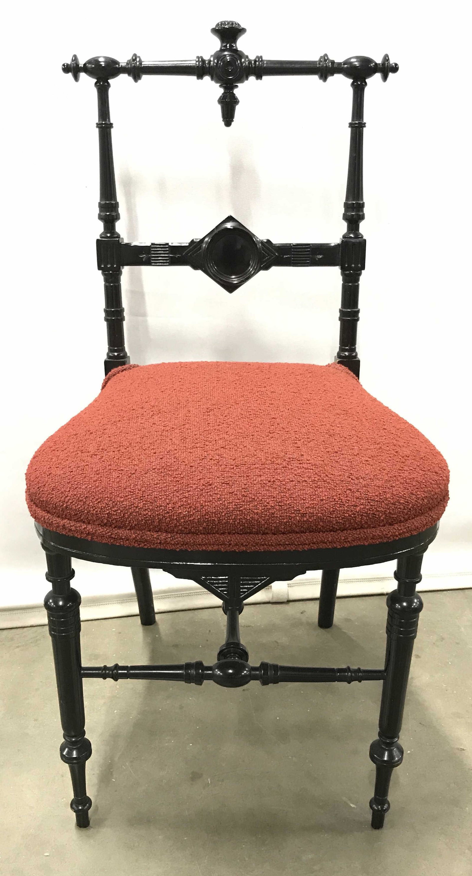 Vintage Carved Black Lacquered Side Chair: Vintage possibly antique Black Lacquered Side Chair with intricately turned and carved, back, legs and stretchers, custom upholstered seat in red toned fabric with double welted trim, minor wear to pa