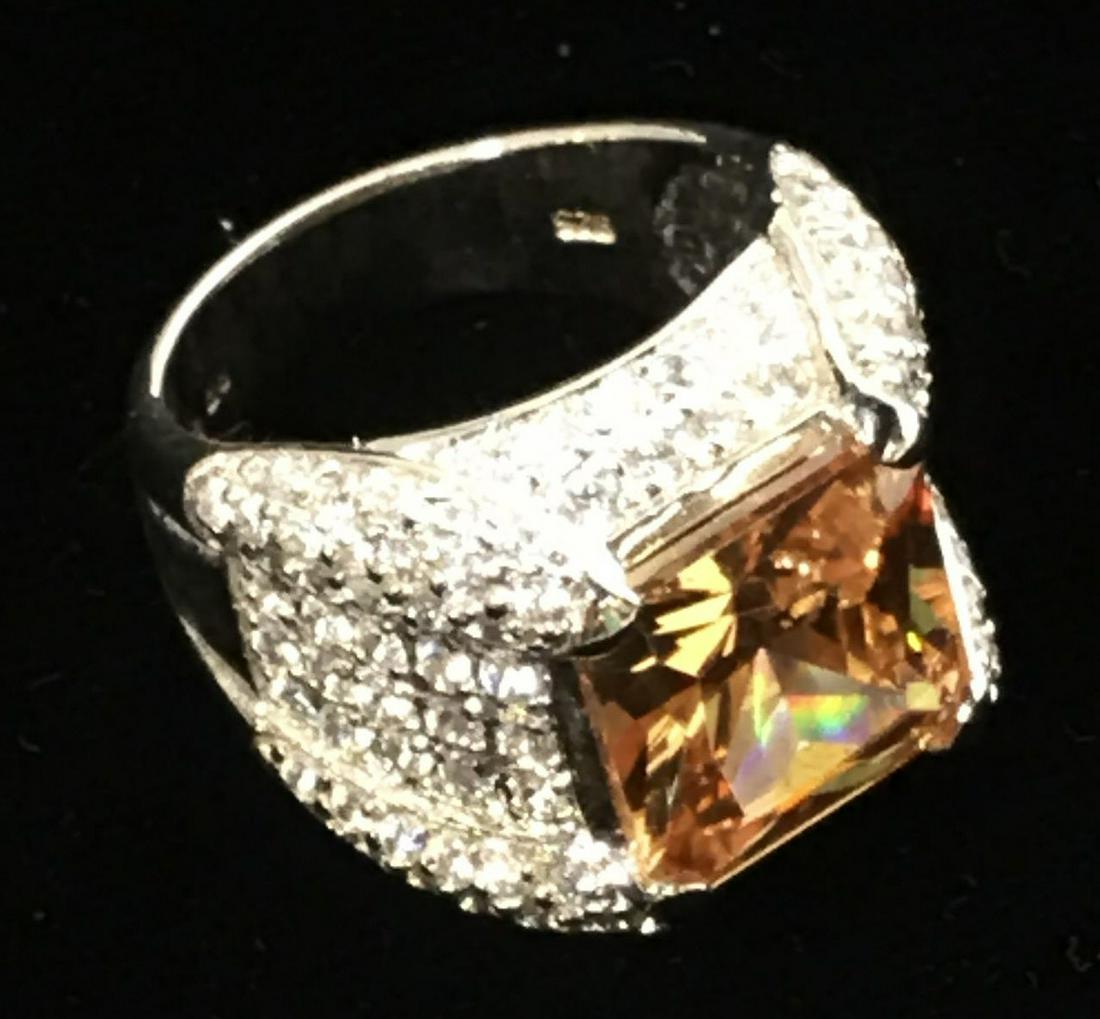 Cubic Zirconia Sterling Silver Cocktail Ring, sz 9: Square cut & faceted Large Center Topaz Cubic Zirconia Solitaire, marked 925, marked CZ, flanked on all 4 sides with clear AB Crystals, open Gallery. Center stone measures 12 x 12 mm. Property of Uppe