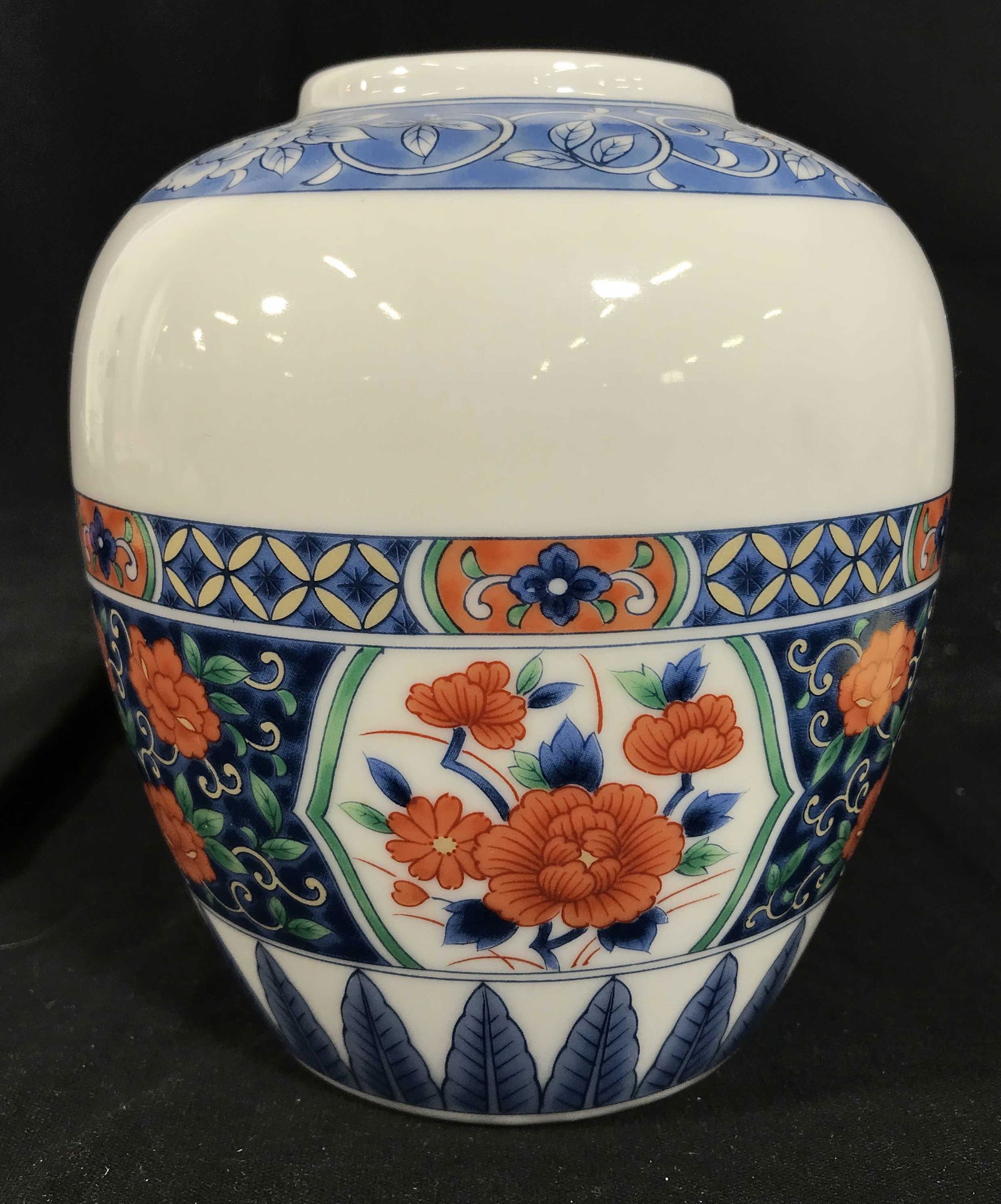 Tiffany & Co Floral Vase Made in Japan: Reads Tiffany & Co made in Japan, stamped under glaze with additional sticker, white toned porcelain, gilt trim, floral designs in tones of blue red and yellow, Asian inspired floral motifs, measures