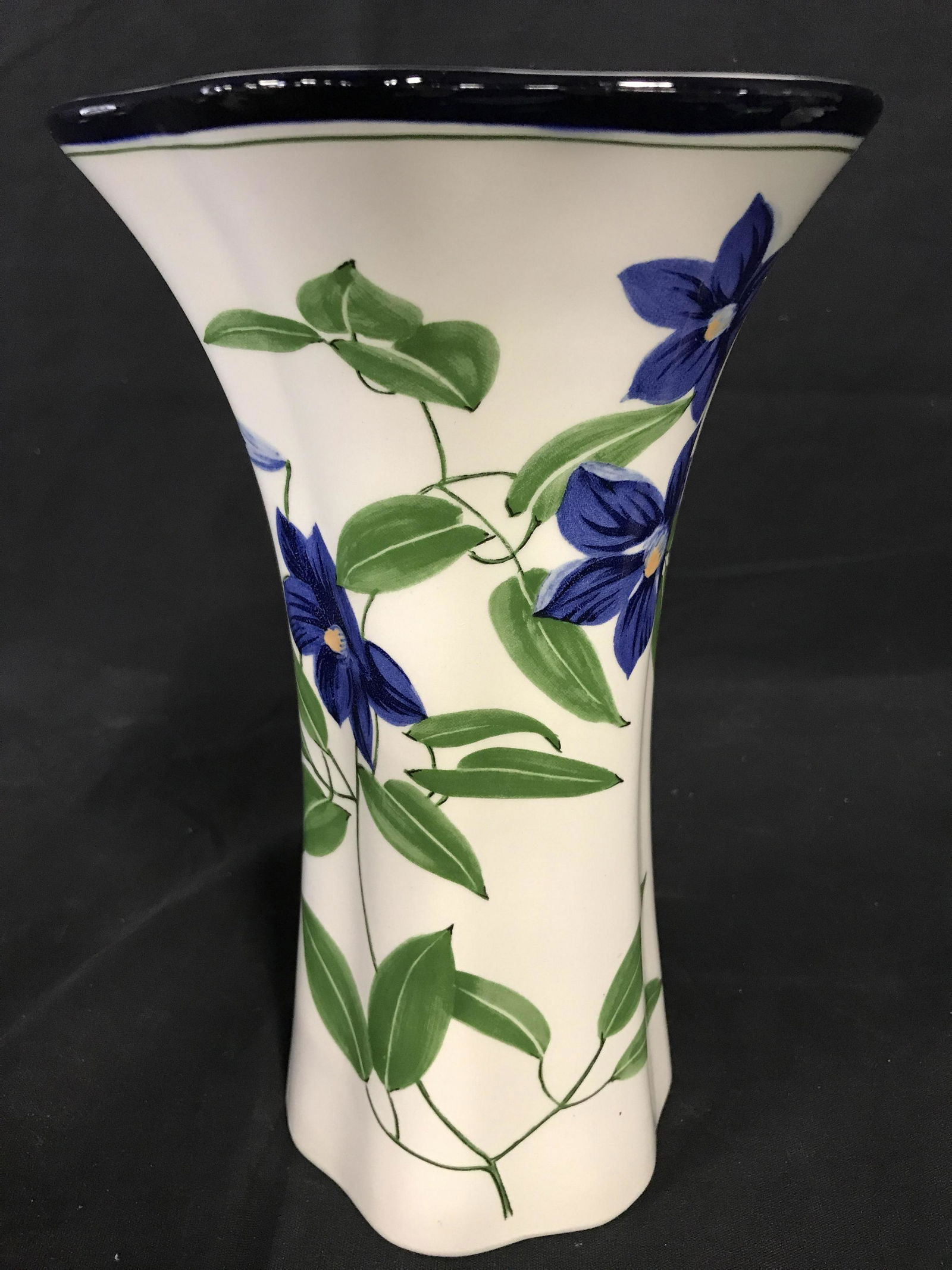 Tiffany & Co Vase, Italy: Underside reads Tiffany & Co, Este CERAMICHE, made in Italy, vase white toned porcelain, black trim with dark blue flower design with green stems and leaves, some minor surface wear. Measures approx 1
