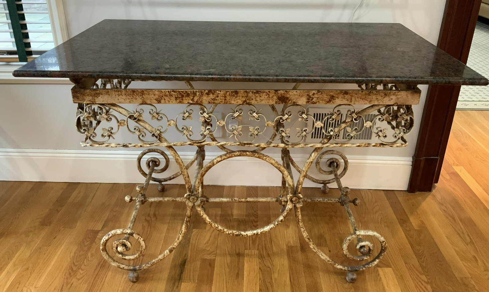Antique Iron French Bakers Table, C 1870: Ornately scrolled iron base and polished black toned stone top, antique French bakers table , gilded iron curly cue base, French circa 1870, measures ht 56 inches, width 41 inches, d 18 inches, up cyc