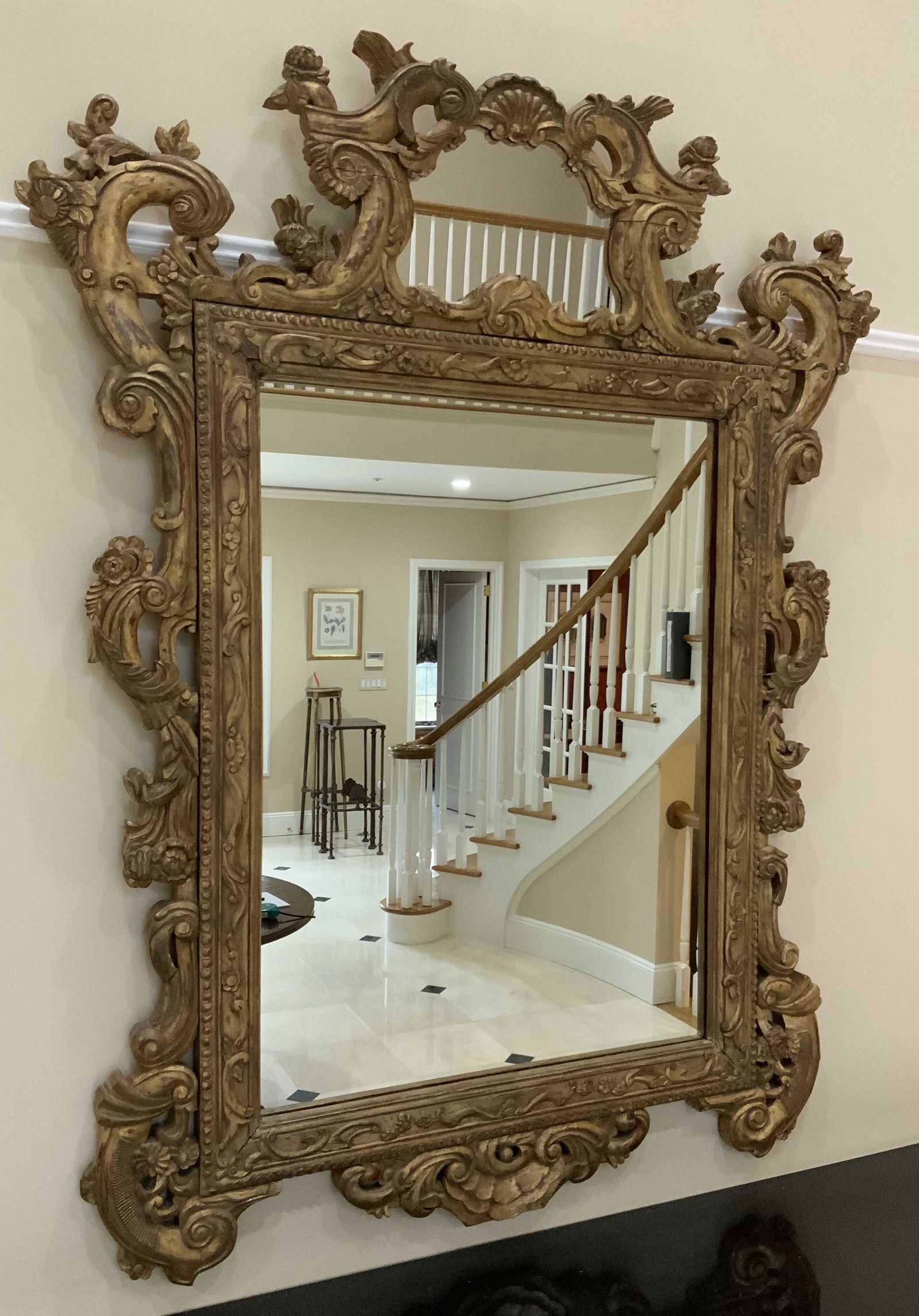 Grand Gilded Hand Carved Antique Double Mirror: Statement sized Antique mirror hand carved with ornate and rich detailing, gold leafed with mirror on mirror design, statement mirror, great in entry hall, continental style, measures ht 70 inches wid