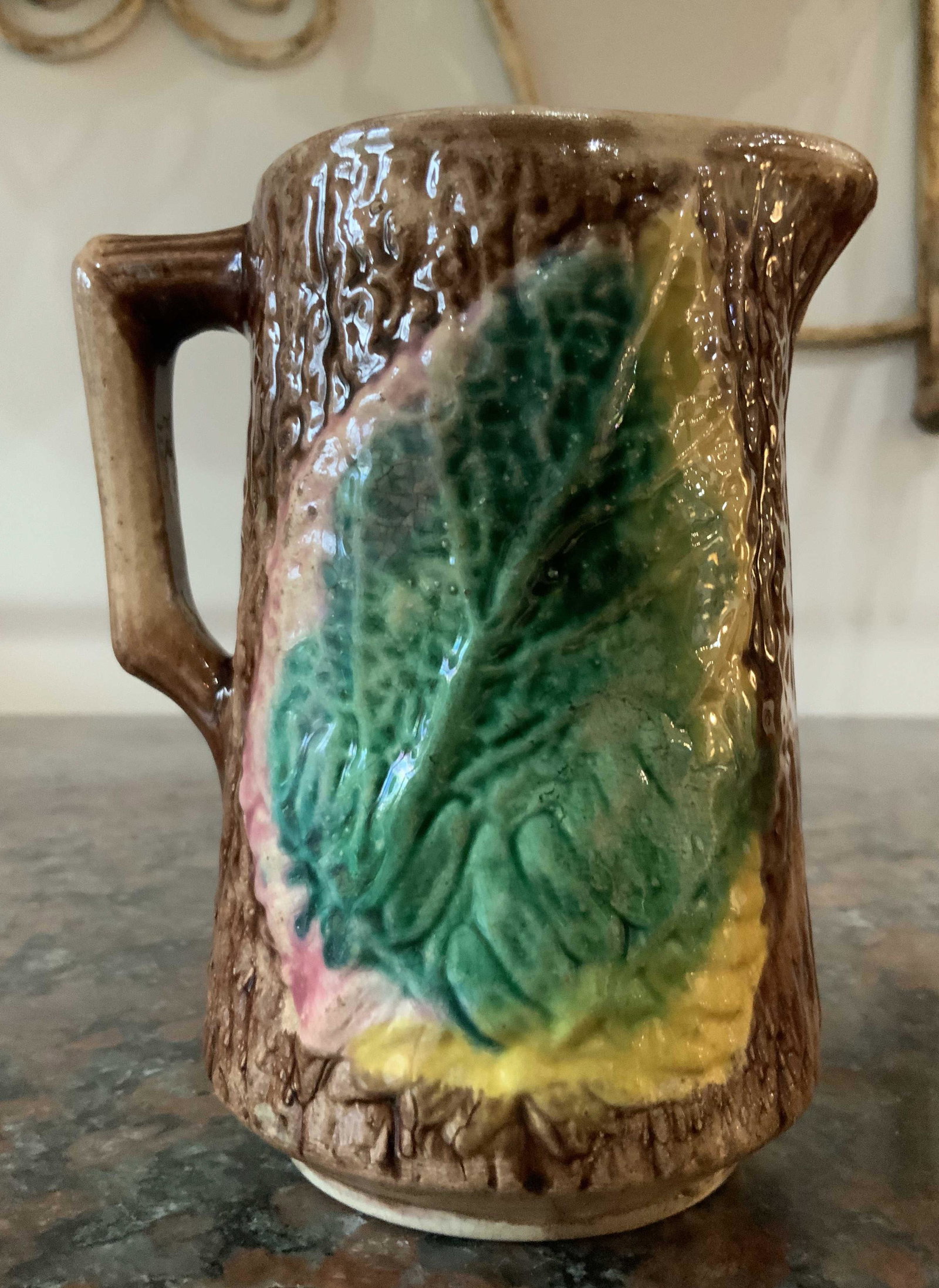 Antique Majolica Pitcher Leaf Design: Vivid green yellow brown glazed ceramic pitcher, collectible majolica, table ware, vase, vessel, pottery, Majolica, measures h6 inches diameter app 5 inches, underside has crack