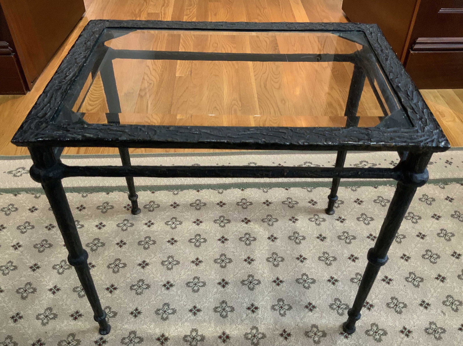 Hand Wrought Bronze And Glass Side Table: Hand forged sculpted bronze metal table with glass top, heavy bronze base in Giacometti Style, sculptural table, side table, end table, occasional table, property of grand rye New York estate, unique 