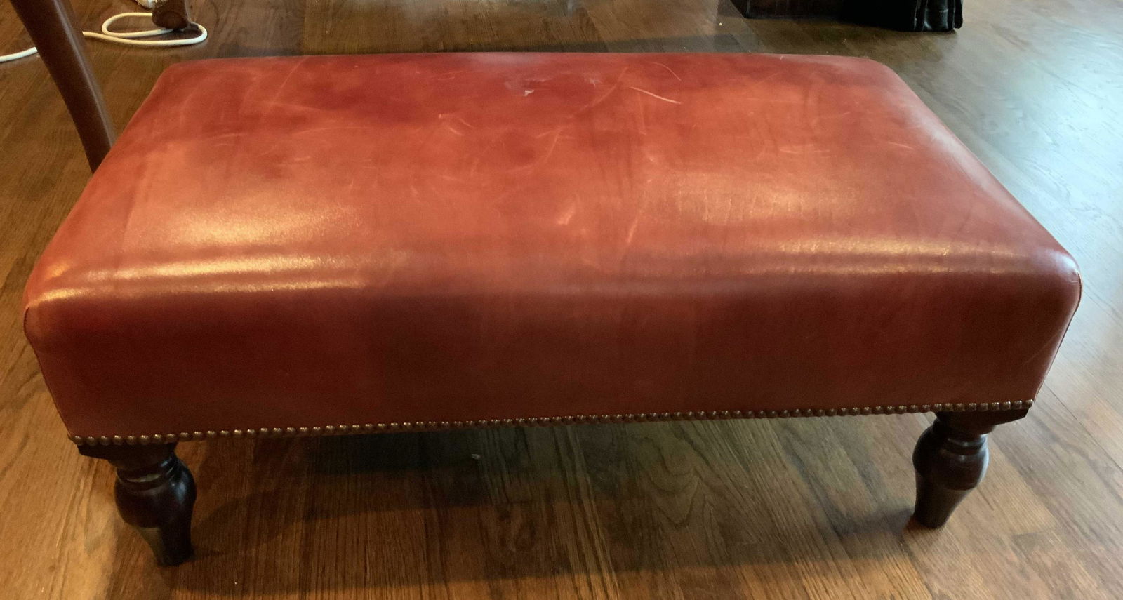 George Smith Red Leather ottoman: Burnished red leather tone, Ottoman Matches two club chairs in preceding lot, marked for George Smith luxury furniture home decor, ottoman,bench, seat, haddock, measures ht 14 inches, W 32 inches, d 1