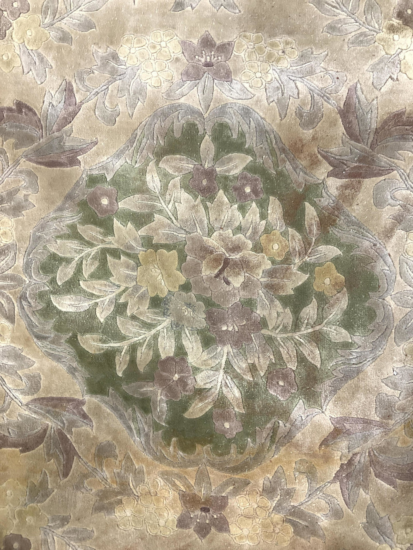 Vintage Handmade Floral Detailed Wool Rug: Rug is wool and handmade. Rug appears to be vintage. Piece has fringes. Rug has multi toned floral and leaf detail. Rug , carpet, area rug, area carpet, wool rug, handmade rug, vintage rug, floral rug