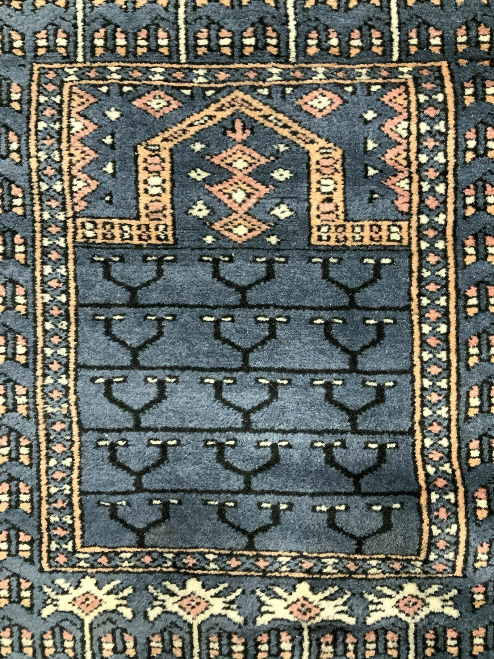 Vintage Handmade Fringed Wool Rug: Rug is wool and handmade. Piece is fringed. Rug has multi toned geometric detail. Piece measures approximately 40 inches long 24 inches wide. Rug, carpet, wool rug, area rug, area carpet, handmade rug