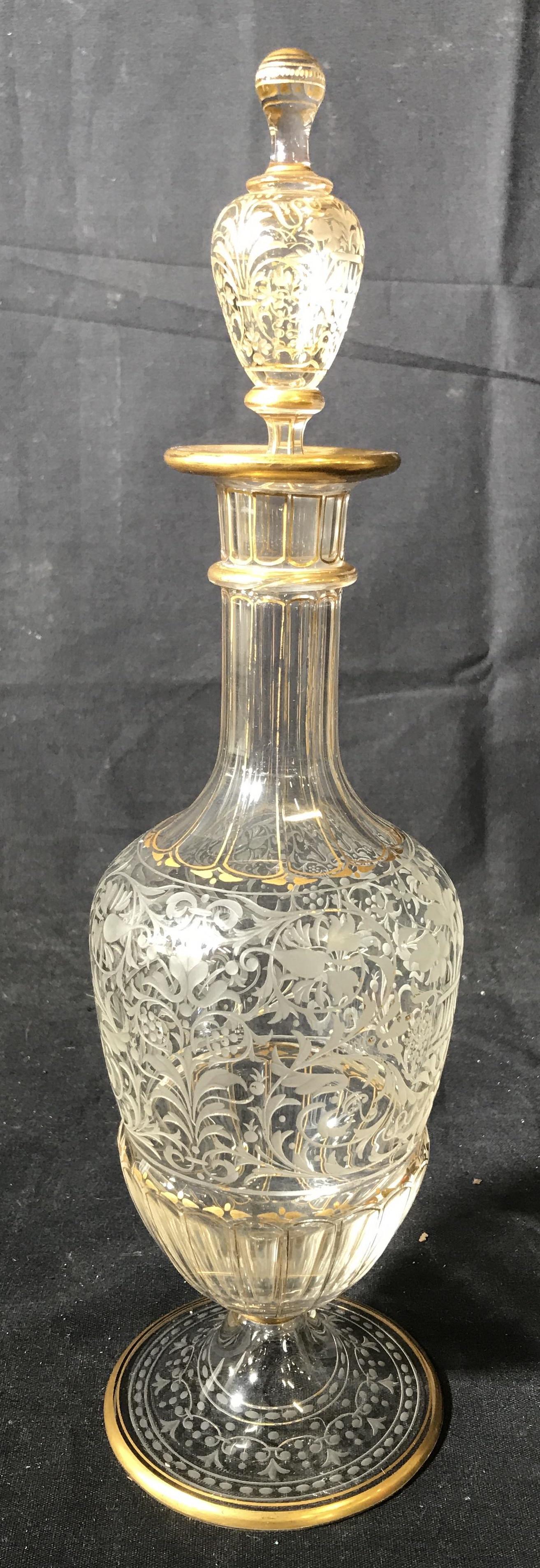 Etched Crystal w Gold tnd trim Decanter: Intricately detailed pedestal footed decanter measures w stopper ht app 14.5 inches, base app 4 inches, bar ware, table ware