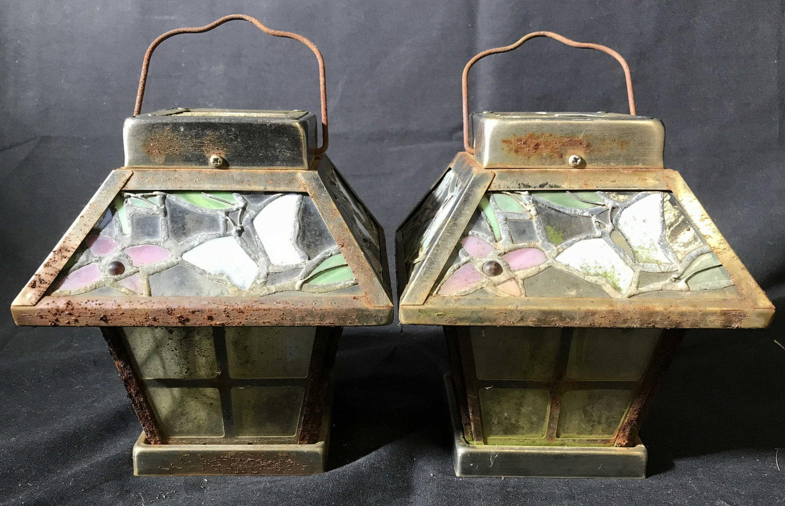 Pair Metal Slag Glass Lanterns: Arts and crafts pair of lanterns, vintage possibly antique, mosaic glass work design, each measures ht app 9 inches to handing arm tops app 7 by 7 inches,rustic condition, some cracks chips to glass, 
