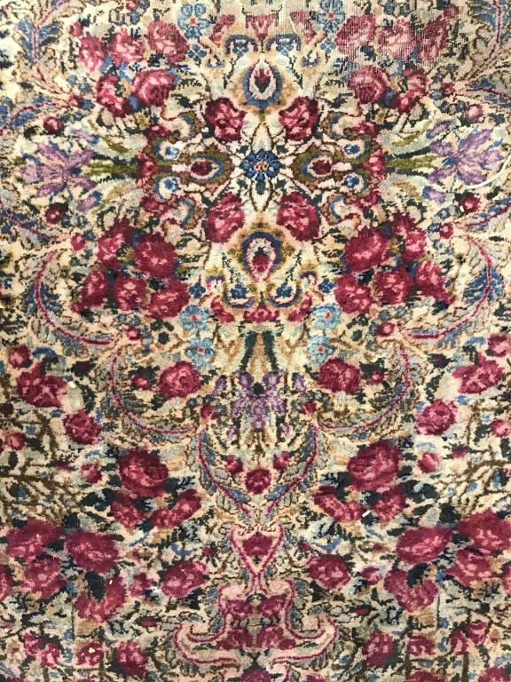 Floral Design Oriental Grand Area Rug: symmetrical floral design w fringes Rug measures approximately 230 inches long 142 inches wide. Piece has some wear, some tears, fading in some areas, needs cleaning, has some staining. home accent, a