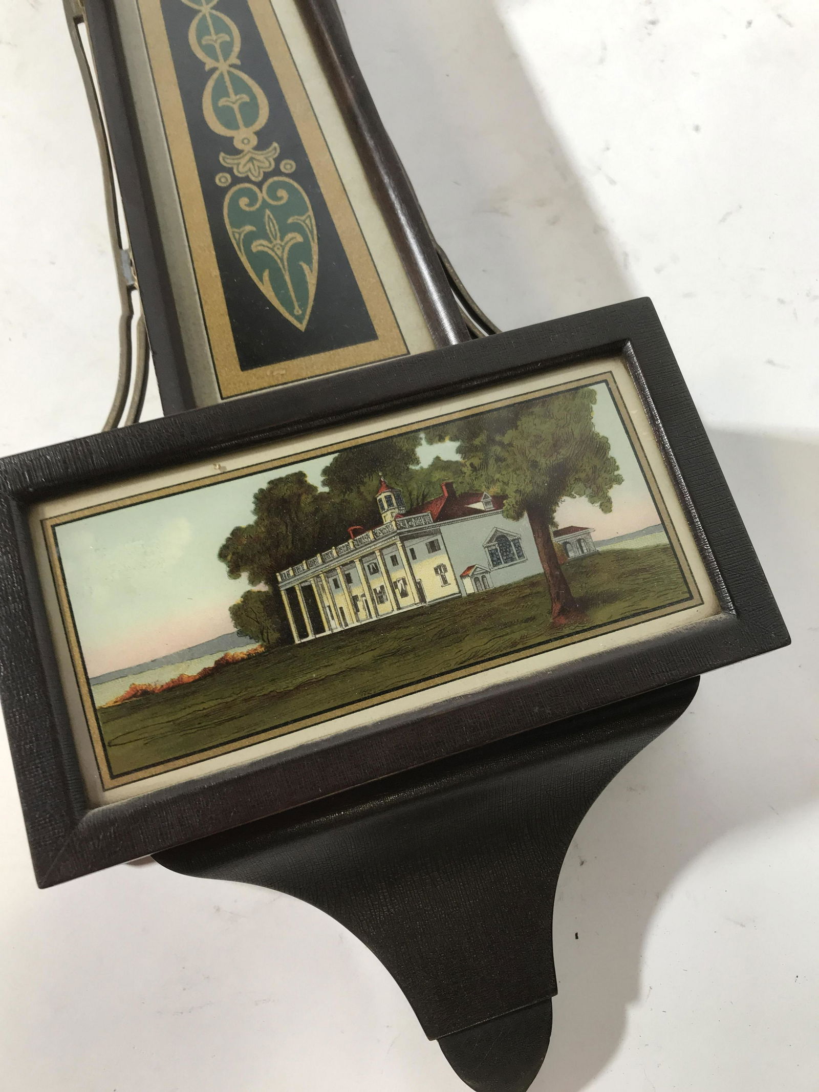 Vintage Wall Clock w Eagle Finial, New Haven: Tall wall mount clock, banjo clock, with central geometric design, and federal style house on lake portrait, name of clock company illegible, vintage possibly antique wall clock, measures app 25 inche