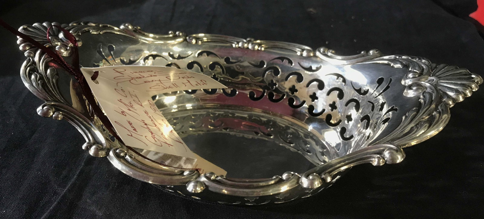 Gorham Pierced Sterling Silver Candy Dish: Dish measures 8.25 inches length ht 2.5 inches depth app 5.5 inches, marked underside Gorham 1998, multiple trade marks, has card attached from Nelson and Nelson, Shell Motif sterling silver tableware