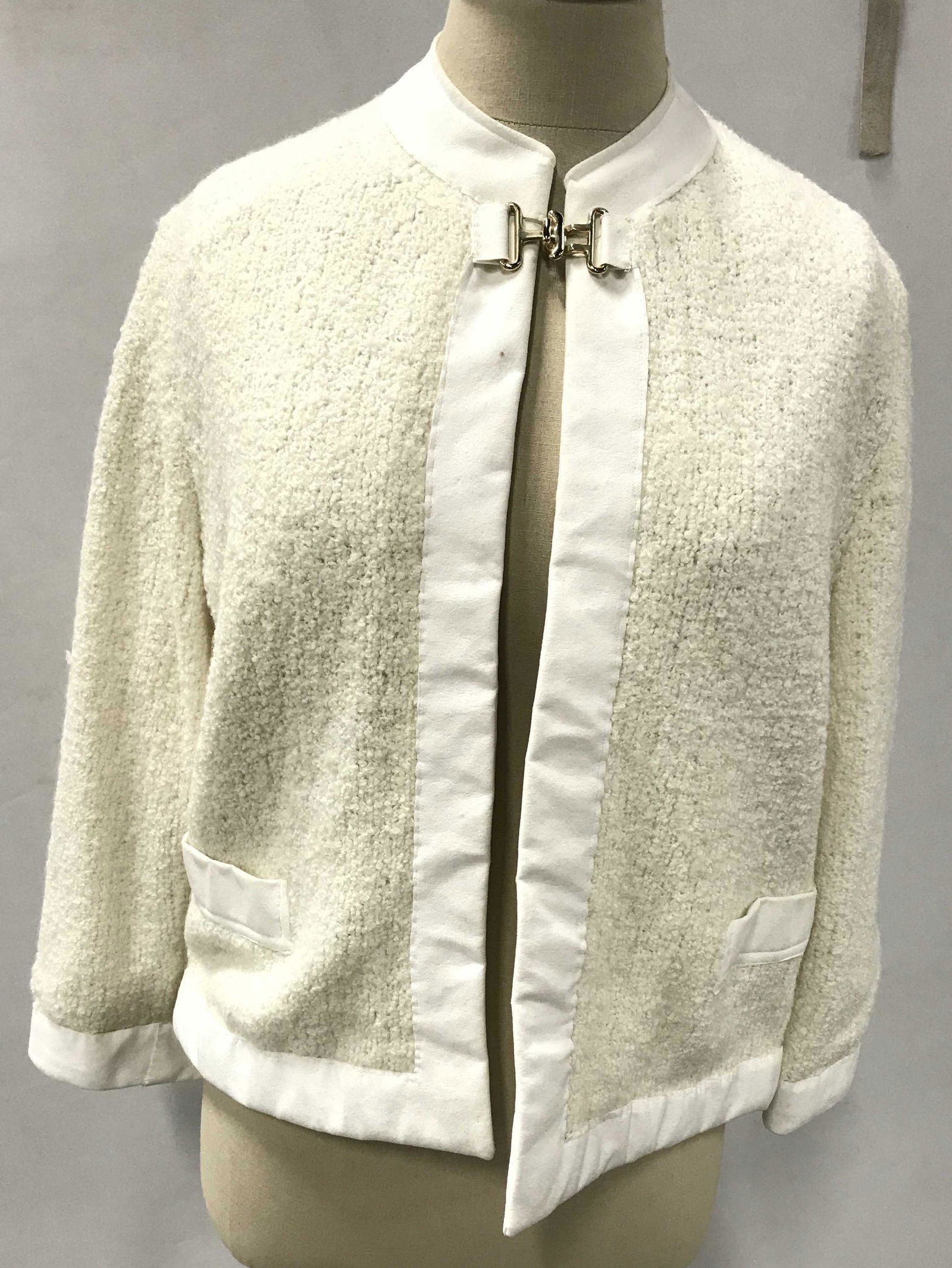 Vintage Cream Toned Sweater: Possible boucle pearl-toned sweater with Intricate Metal clasp by neckline. Possible suede trim with suede pockets. Fits size small- medium. Vintage boucle, vintage sweater, clasp sweater, vintage fas