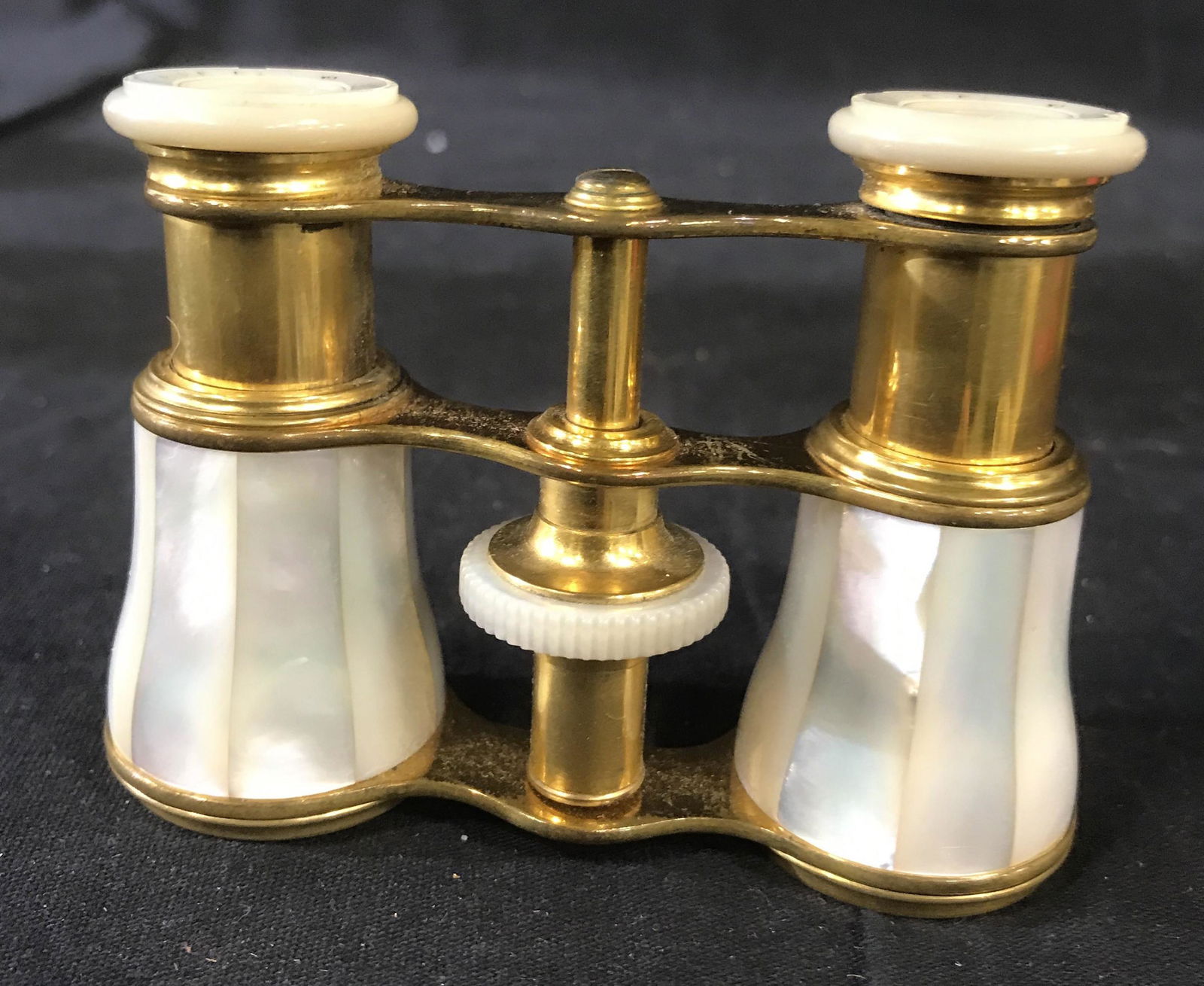 Mother of Pearl Brass Opera Glasses, France: Made in France Vintage possibly antique opera glasses, collectible desk top accessory, measures app 3 by 3.5 inches, rims marked for Paris, additional wording on rims illegible, Paris opera glasses