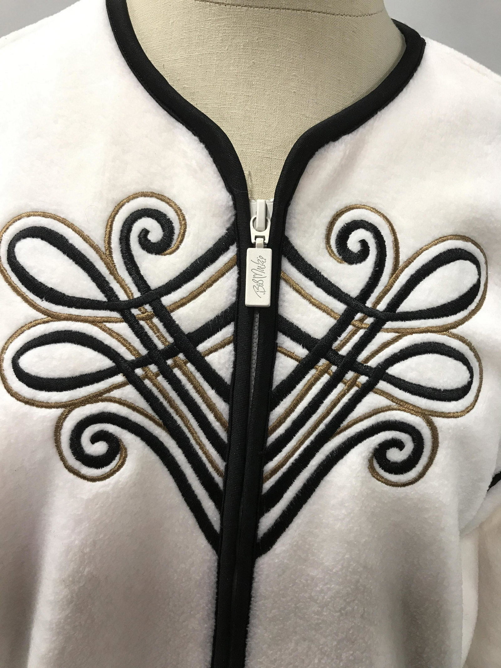 Bob Mackie WEARABLE ART Zip Up Sweater: Rare Bob Mackie Wearable Art vintage zip up fleece sweater. Creme toned base with black and brown embroidered design with black trim surrounding it. Size small. Vintage wearable art, wearable art, zip