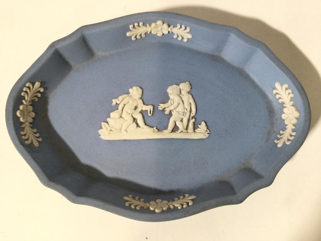 Lot 2 WEDGWOOD Tabletop Accessories: Lot includes 1 WEDGWOOD LIGHTER & 1 Wedgwood trinket Dish. Each are light blue toned. Dish measures approx 4.5 inches long 3 inches deep. Lighter has been repaired. smokers accessory, wedwood jasperwa