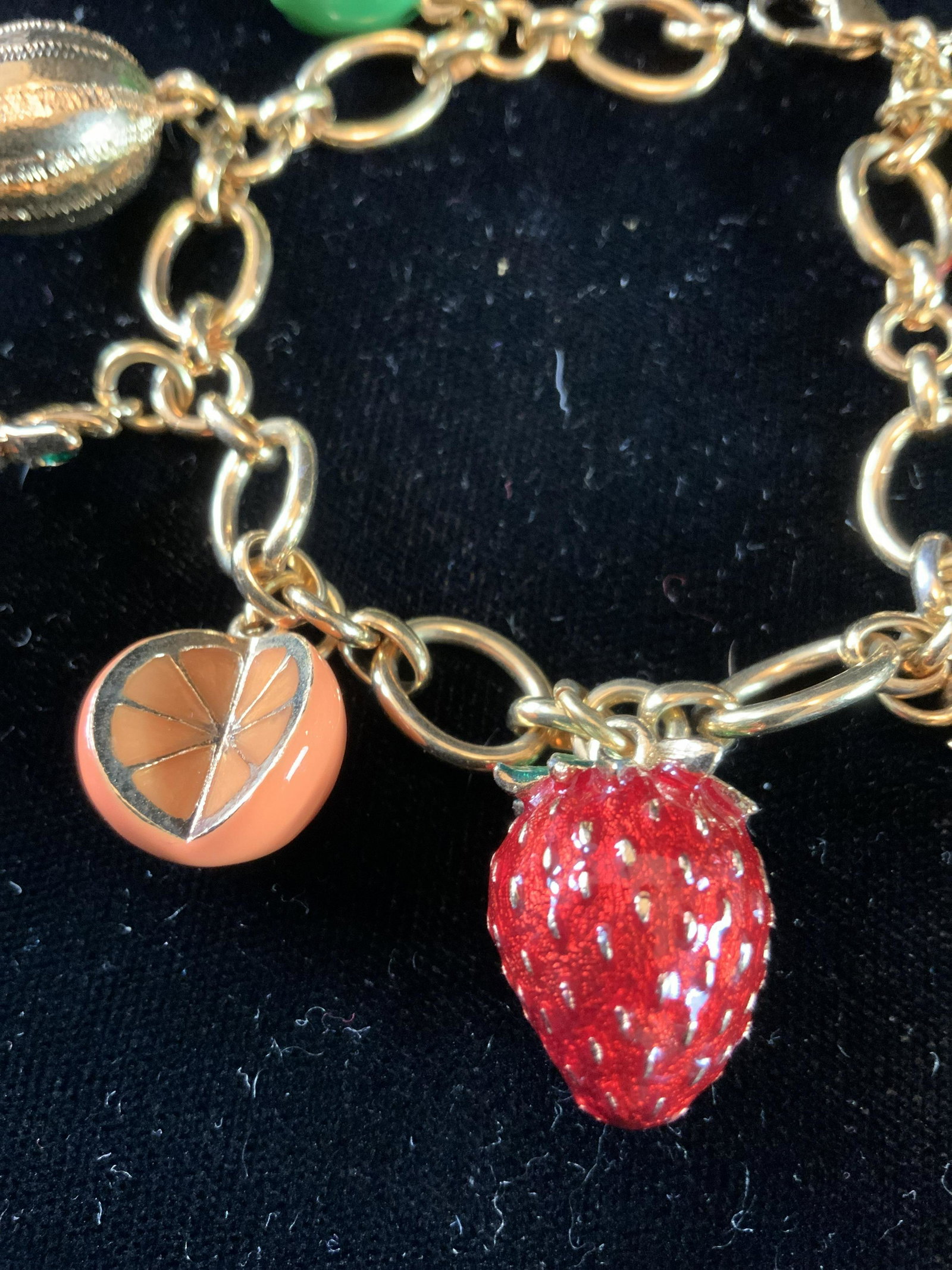 Joan Rivers Gold tnd Enamel Fruit Charm Bracelet: Heavy chain link bracelet with gold toned and enamel fruit charms, estate jewelry, vintage jewelry, designer fashion jewelry, length of bracelet app 7.5 inches