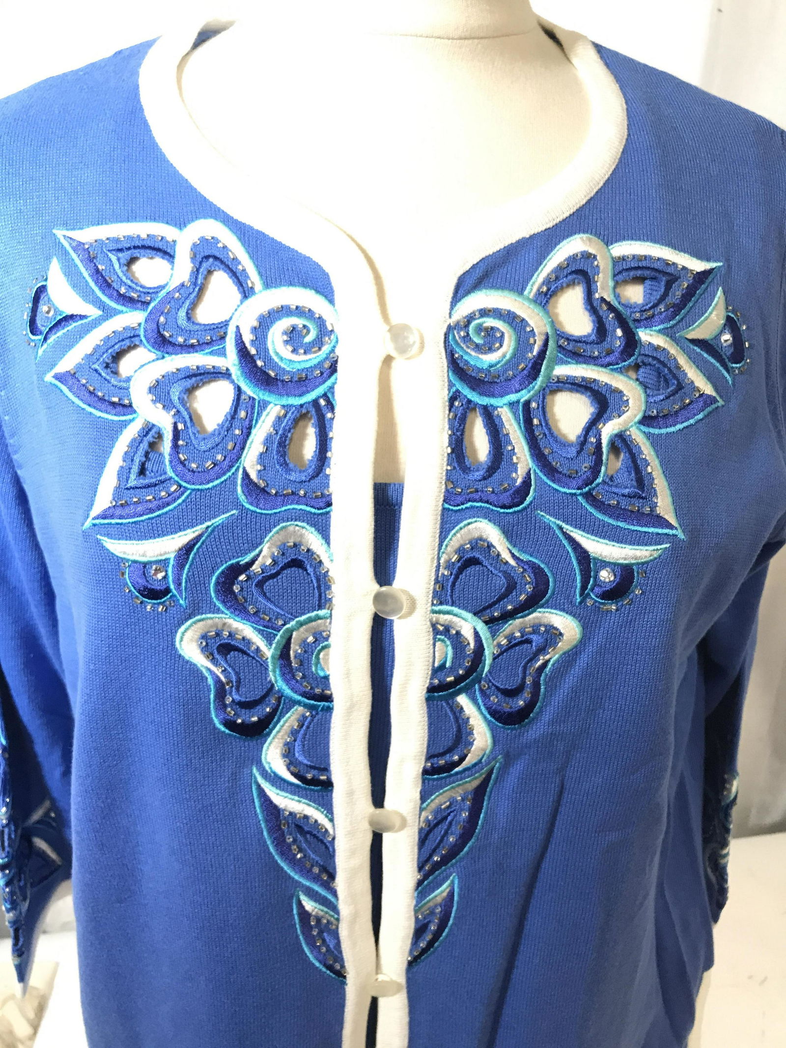 Periwinkle Bob Mackie Sweater Set, Sz Med: Bob Mackie sweater from his high-end ready-to-wear collection. 60% Cotton, 40% acrylic. Sleeveless Sweater top with wide square collar. Long sleeve appliqué embroidered Cardigan with white trim. Prop