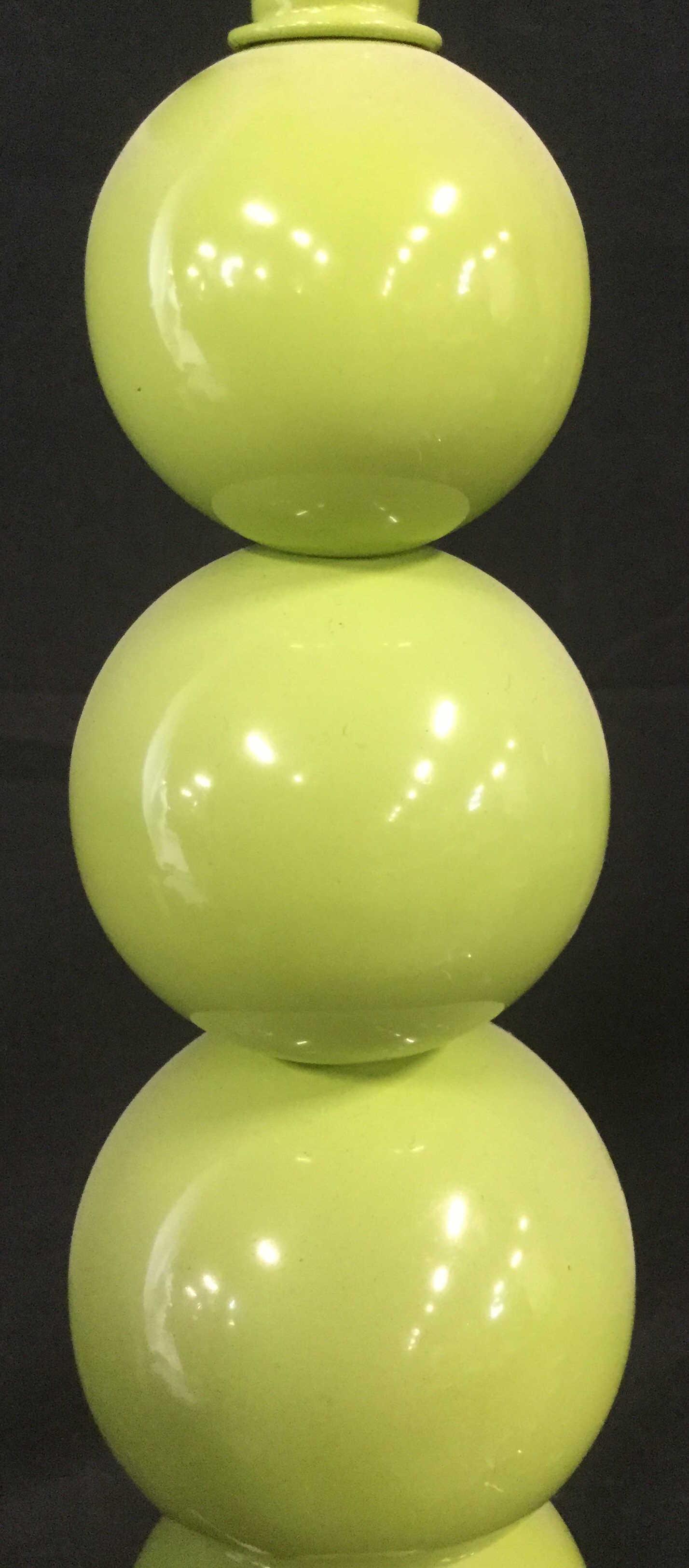Green Mod Inspired SAFAVIEH Large Orb Lamp: Oversized green tabletop lamp. Interior decorative art. Round base for stability supporting a stem made of various sized orbs stacked on one another. Harp with small decorative small orb filial that m