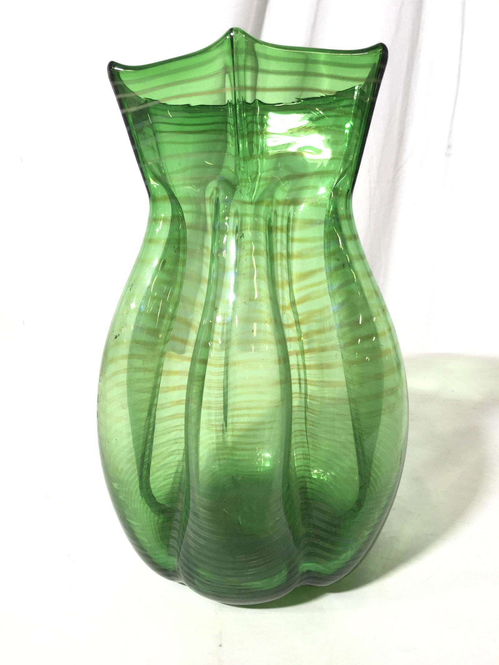 Green Pin Stripe Art Glass Vase: Hand crafted hand formed art glass vase, vessel, decorative table ware, decorative arts, ht app 11 inches diameter app 8 inches, signed underside with two interlocking triangles, property of New York 