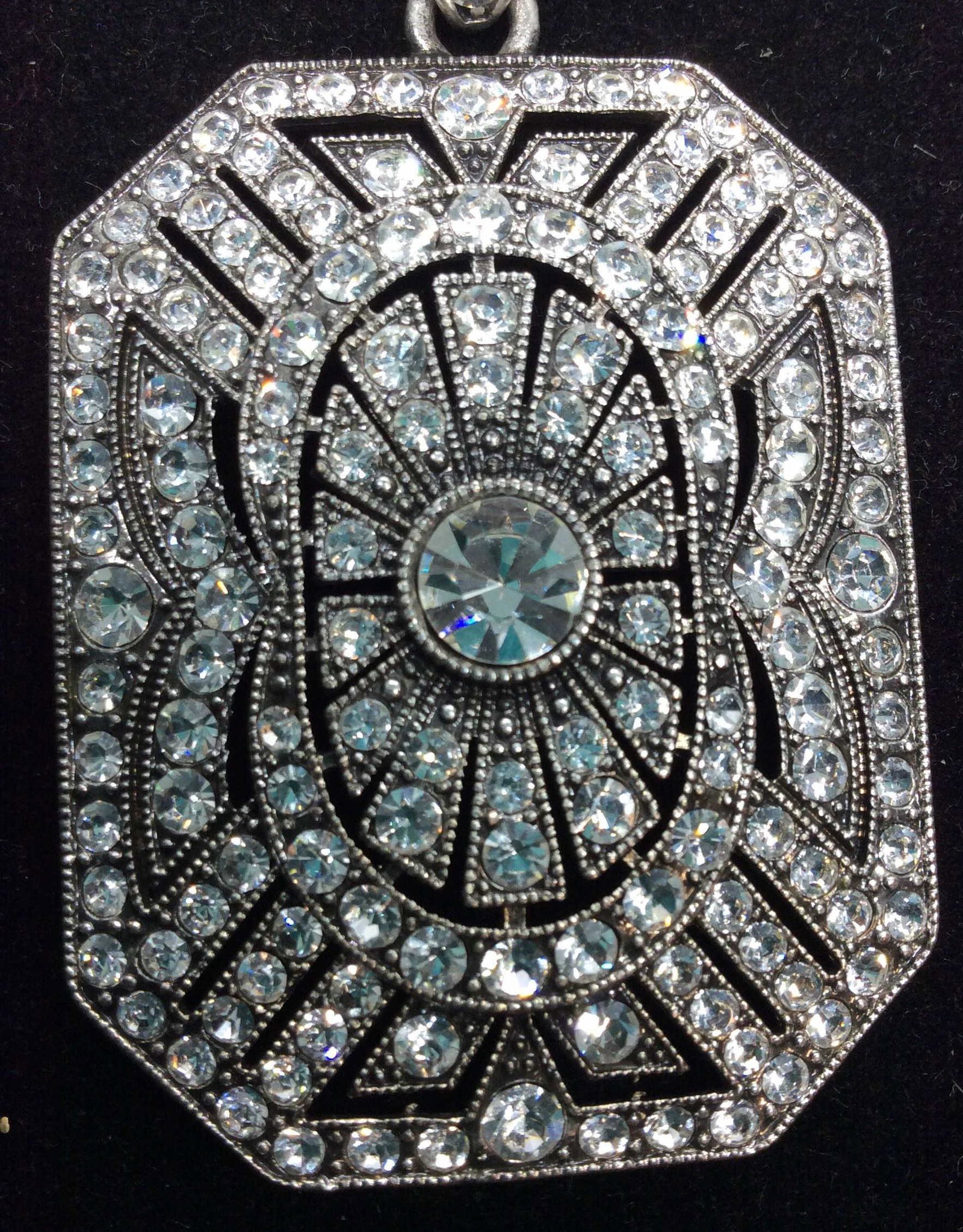 Rhinestone Art Deco Pendant Necklace: Diamond cut ball chain with large lobster clasp. Adjustable length, 28- 26 in. Brilliant Art Deco Style Pendant, app 3 in. L ( with bail) by 1.5 in. W. Rhinestones, Backside reads ‘PA cn’ with Etc