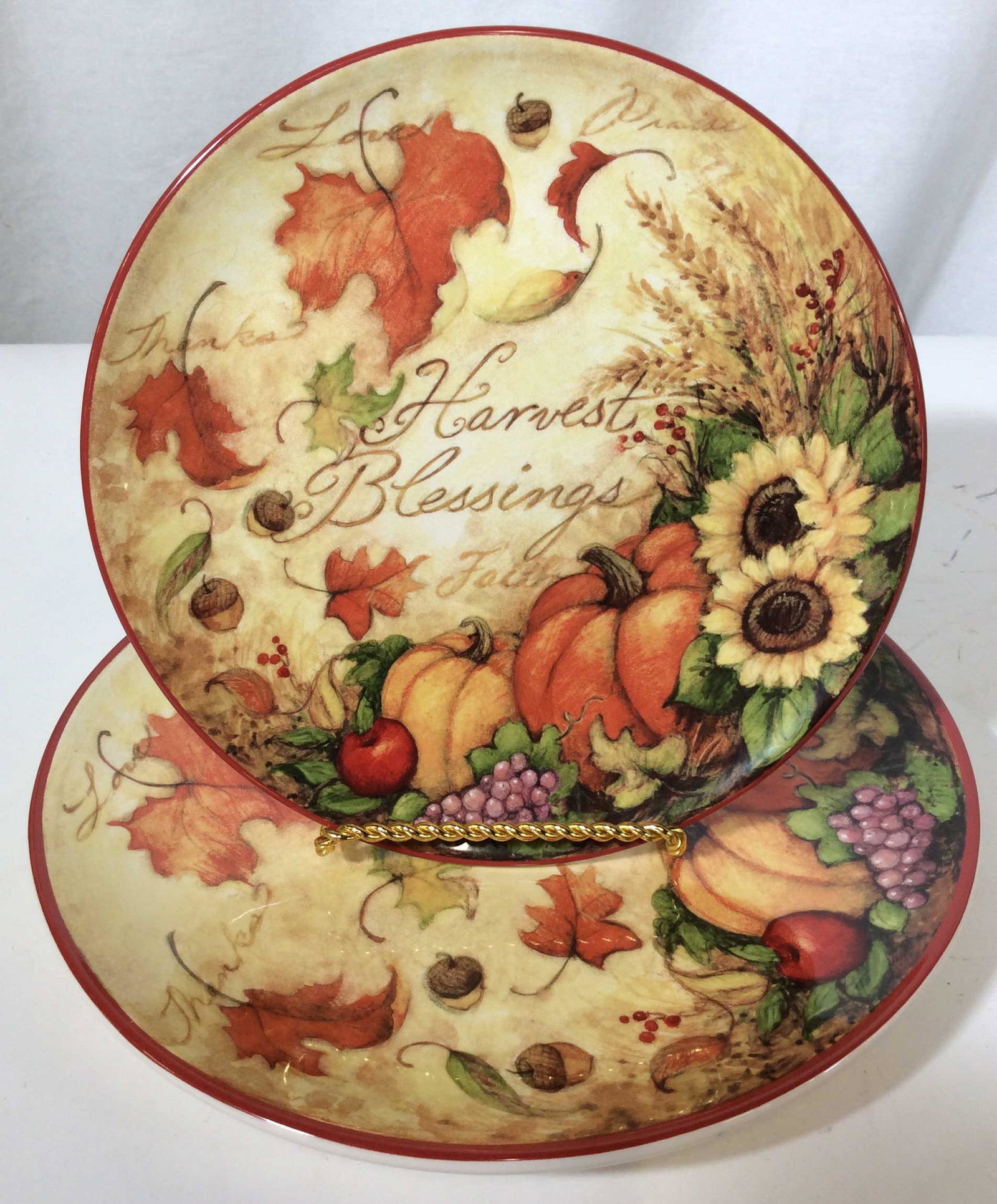 Lot 13 Assorted Colorful Ceramic Dinnerware: This lot includes 13 ceramic Dinnerware pieces. Each piece is decorated with varying designs. The largest piece measures approx 12.12 inches in diameter. The pieces are new and unused. Holiday plate, 